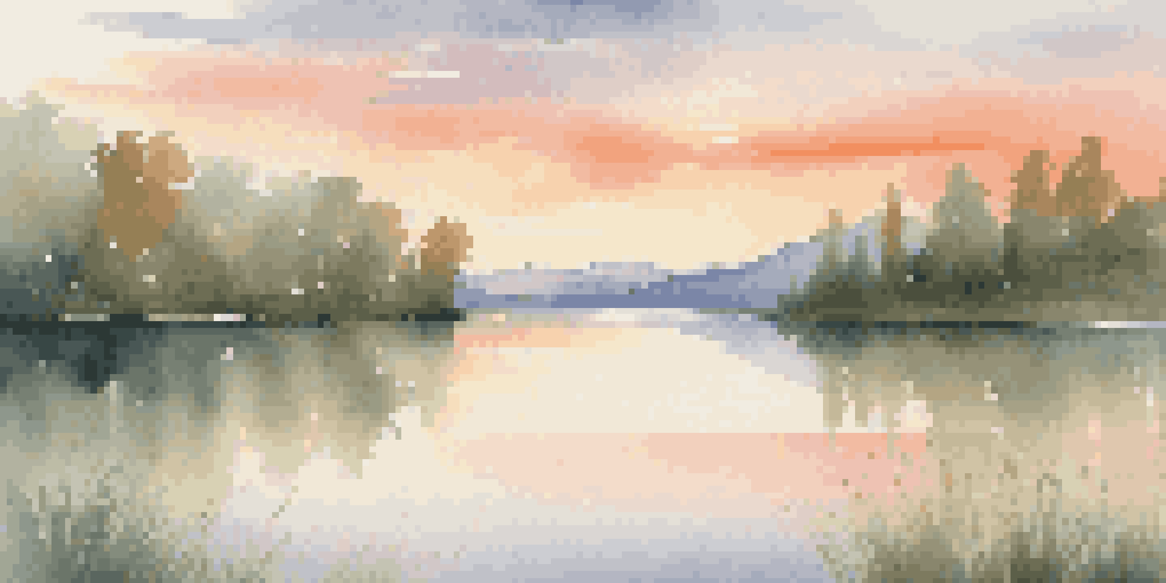 A calm lake at sunset surrounded by greenery and mountains, reflecting warm colors in the water.