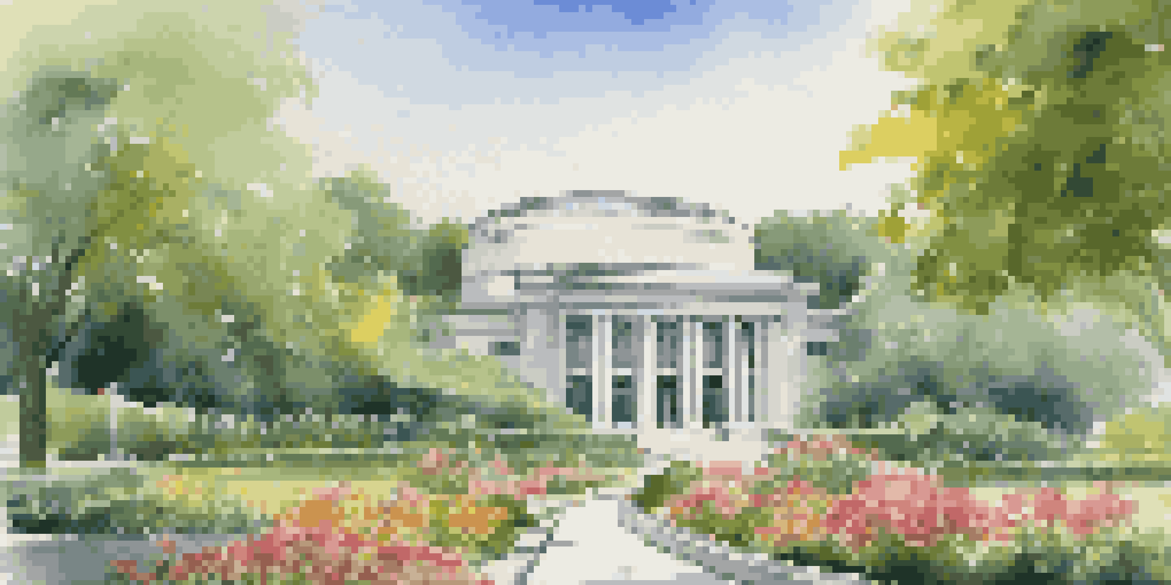 A modern central bank building set in a lush green environment with bright flowers in the foreground and a clear blue sky.