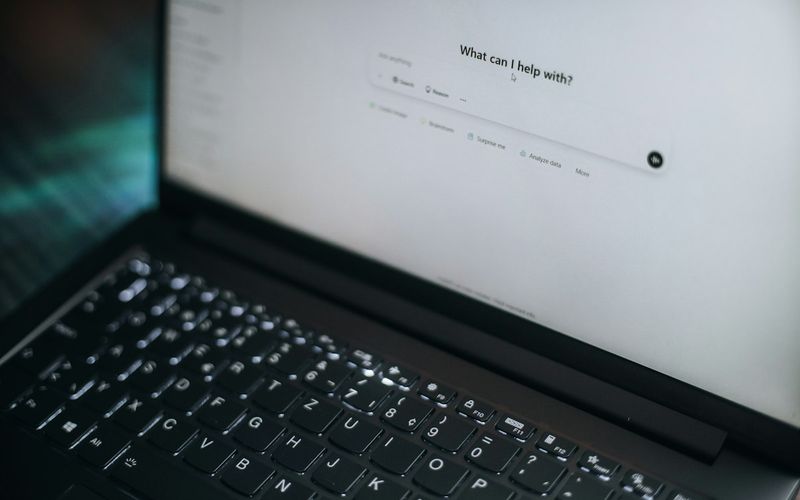 Laptop screen showing an AI chat prompt box
