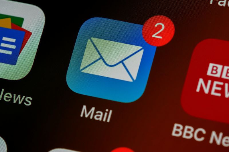Close-up of a mail app icon on a smartphone screen