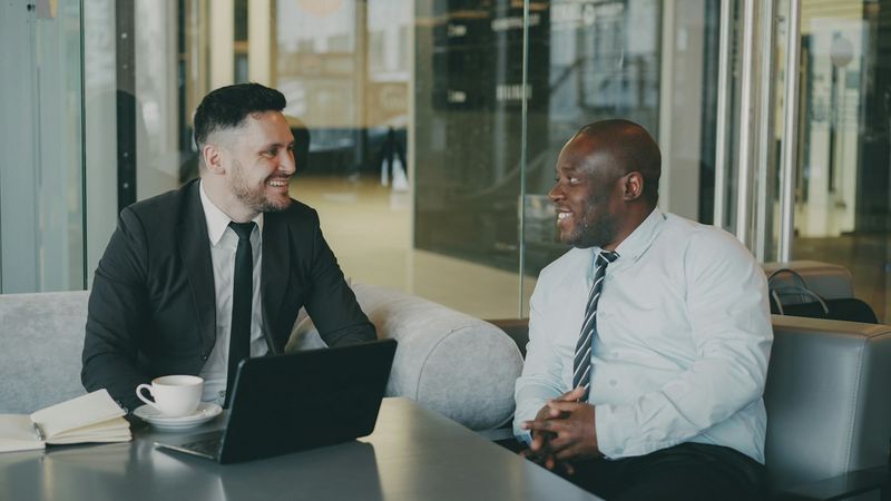 Two people talking in a modern office