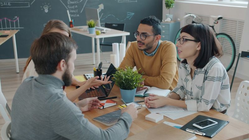 A team working together around an office table