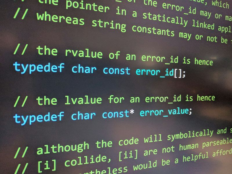 Angled close-up of a monitor displaying code