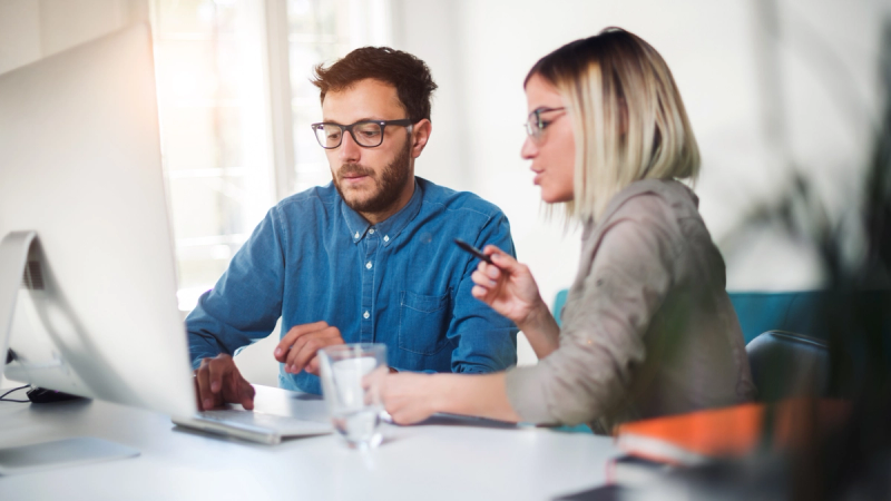 Business owners looking into non-bank lending solutions in a modern office environment.