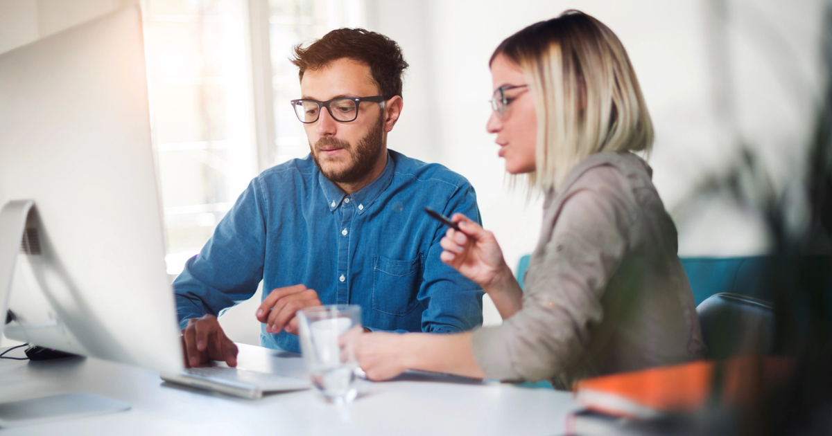 Business owners looking into non-bank lending solutions in a modern office environment.