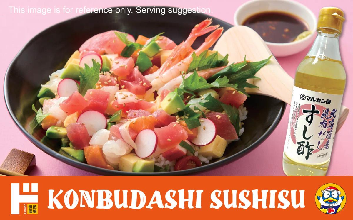 Konbudashi sushisu chirashi bowl with sashimi, vegetables, and dipping sauce on pink background