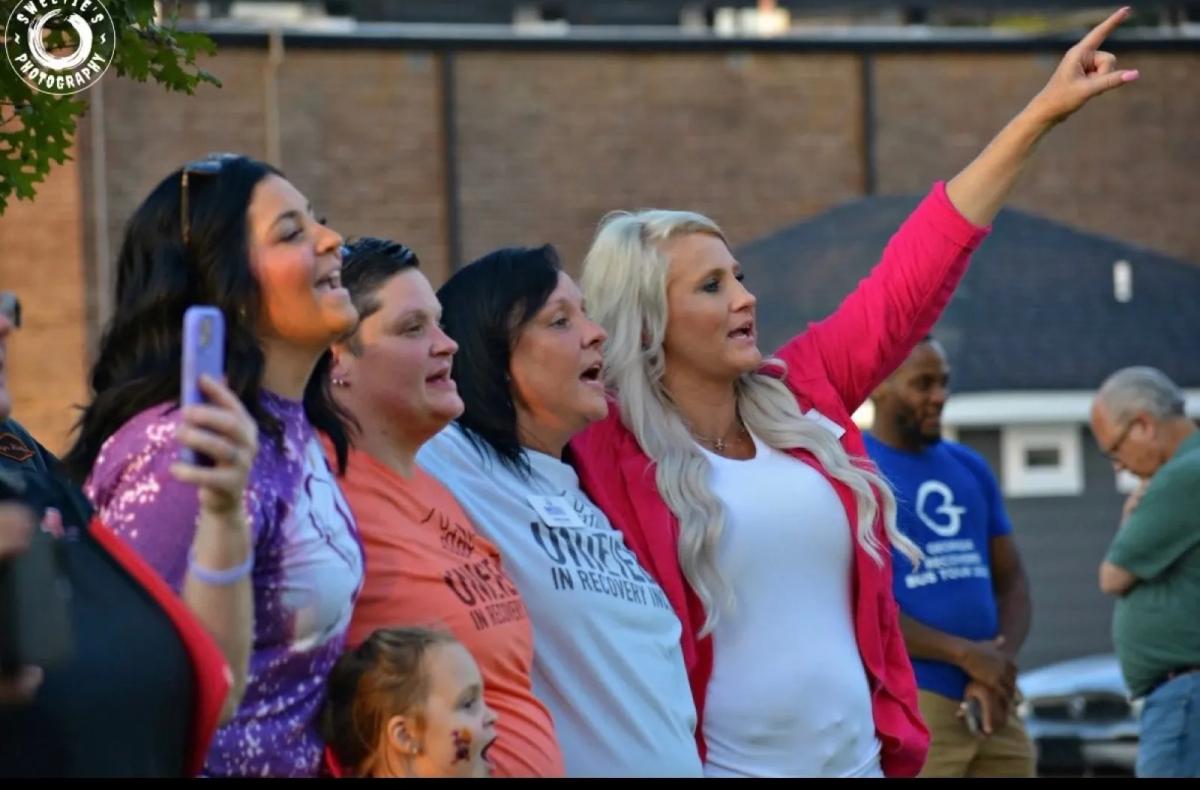Unified in Recovery community members at a community event