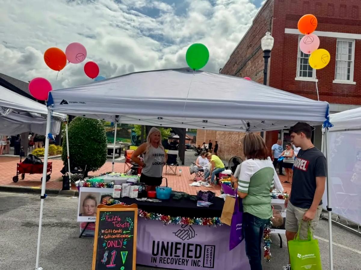 Unified in Recovery community members at a community event