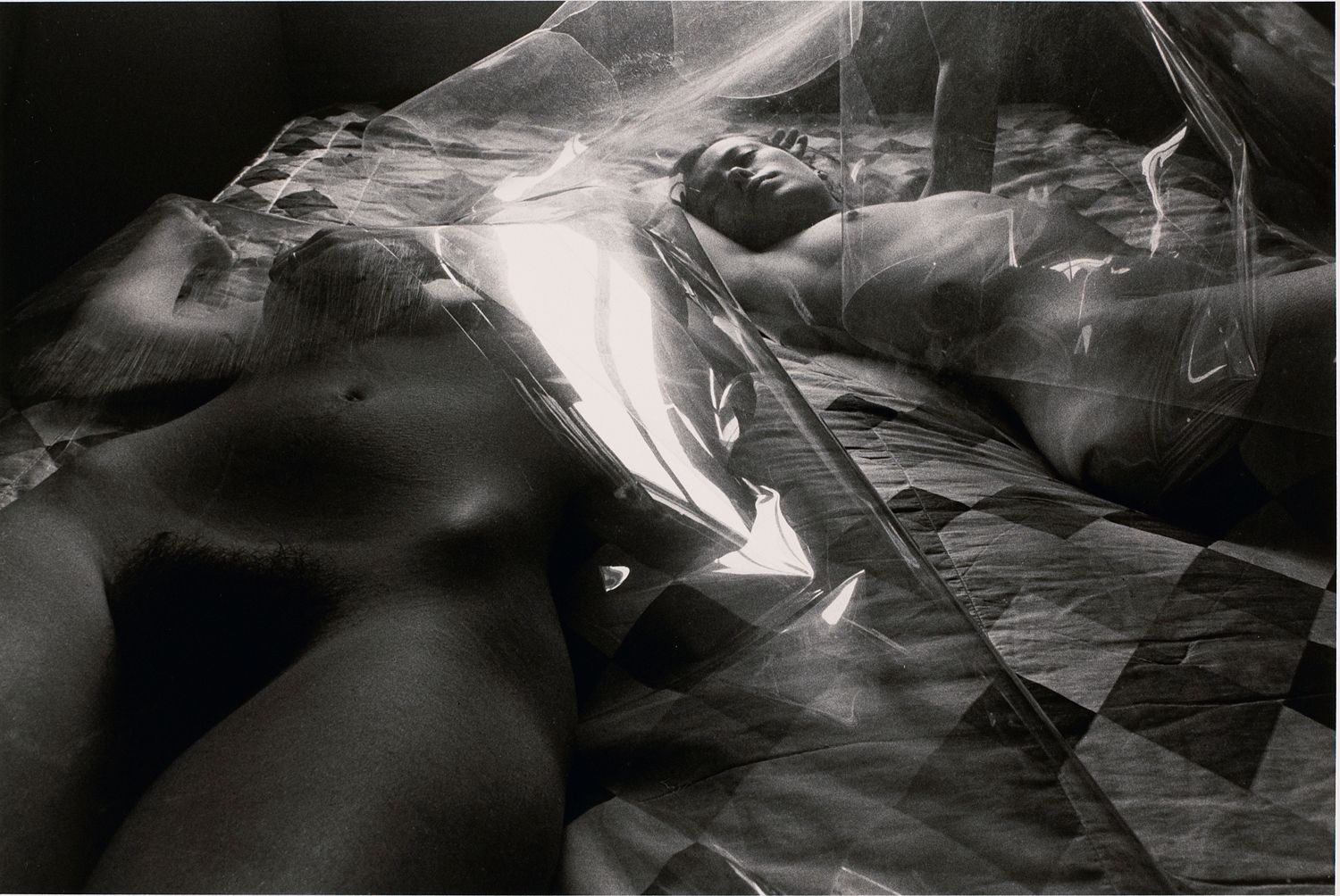 Untitled: Two Women on Bed Under Plastic