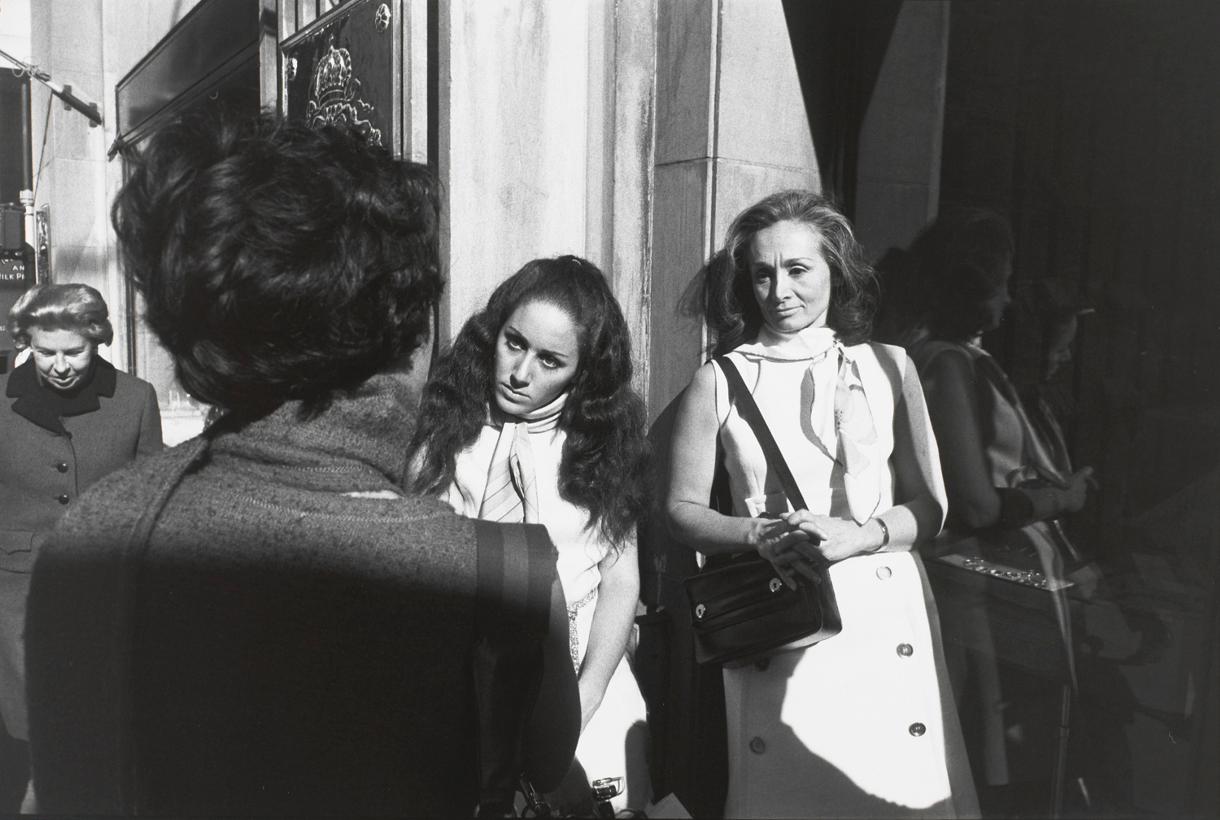 Untitled (Two women in sleeveless dresses and one with back to camera)