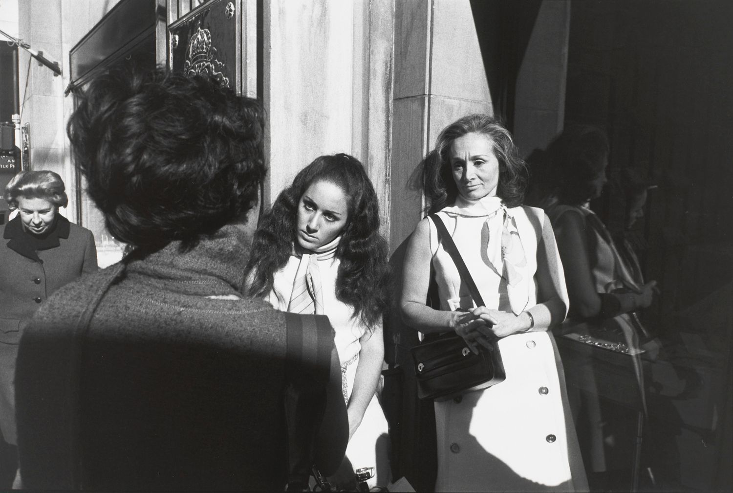 Untitled (Two women in sleeveless dresses and one with back to camera)