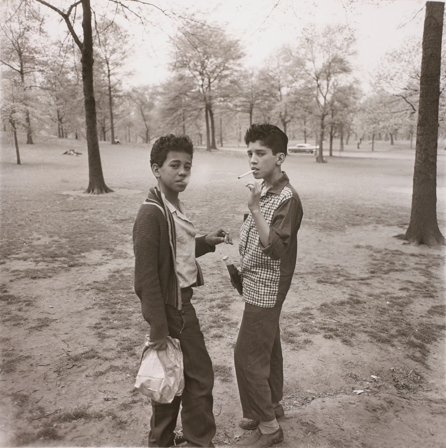 Two boys smoking in Central Park, N.Y.C.