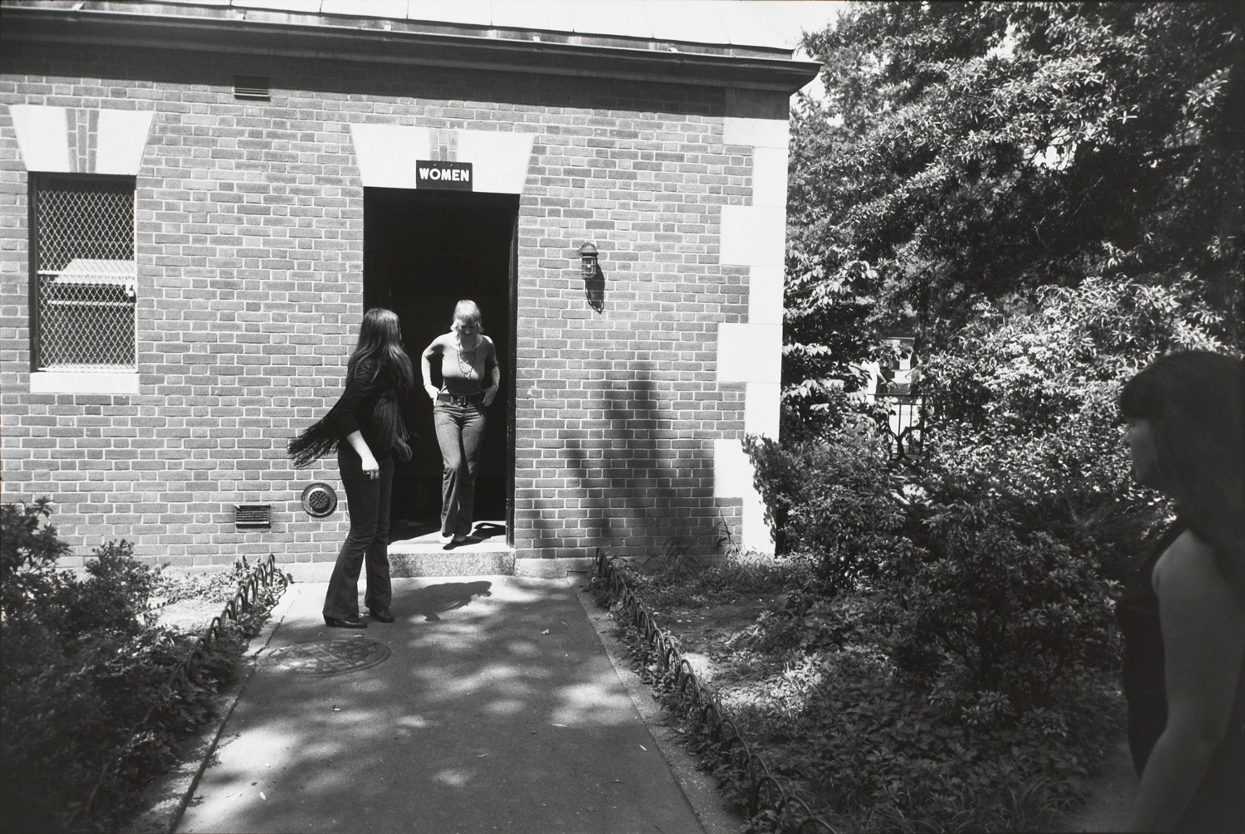 Untitled (Two women coming out of a public restroom)