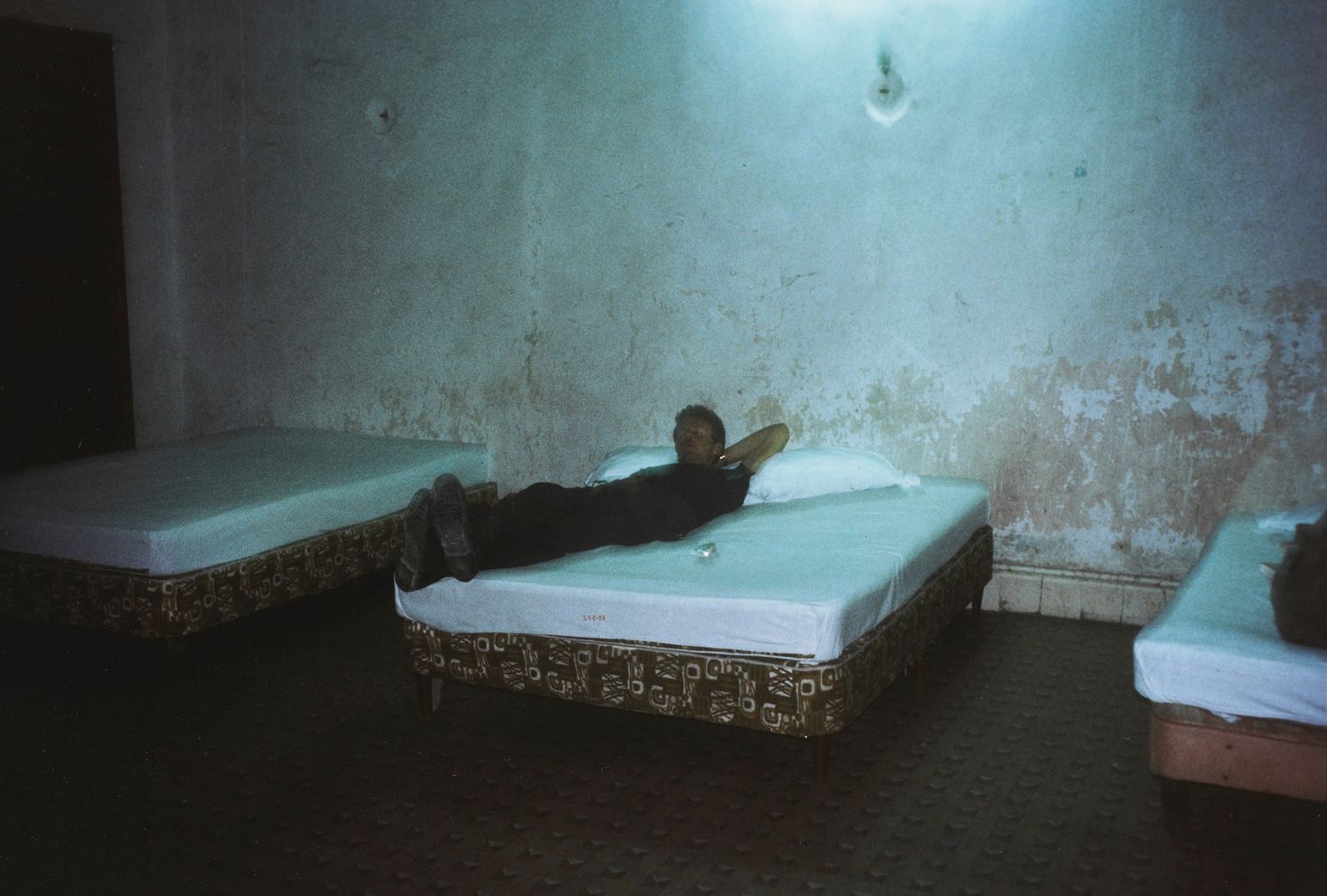 Brian in hotel room with three beds, Merida, Mexico