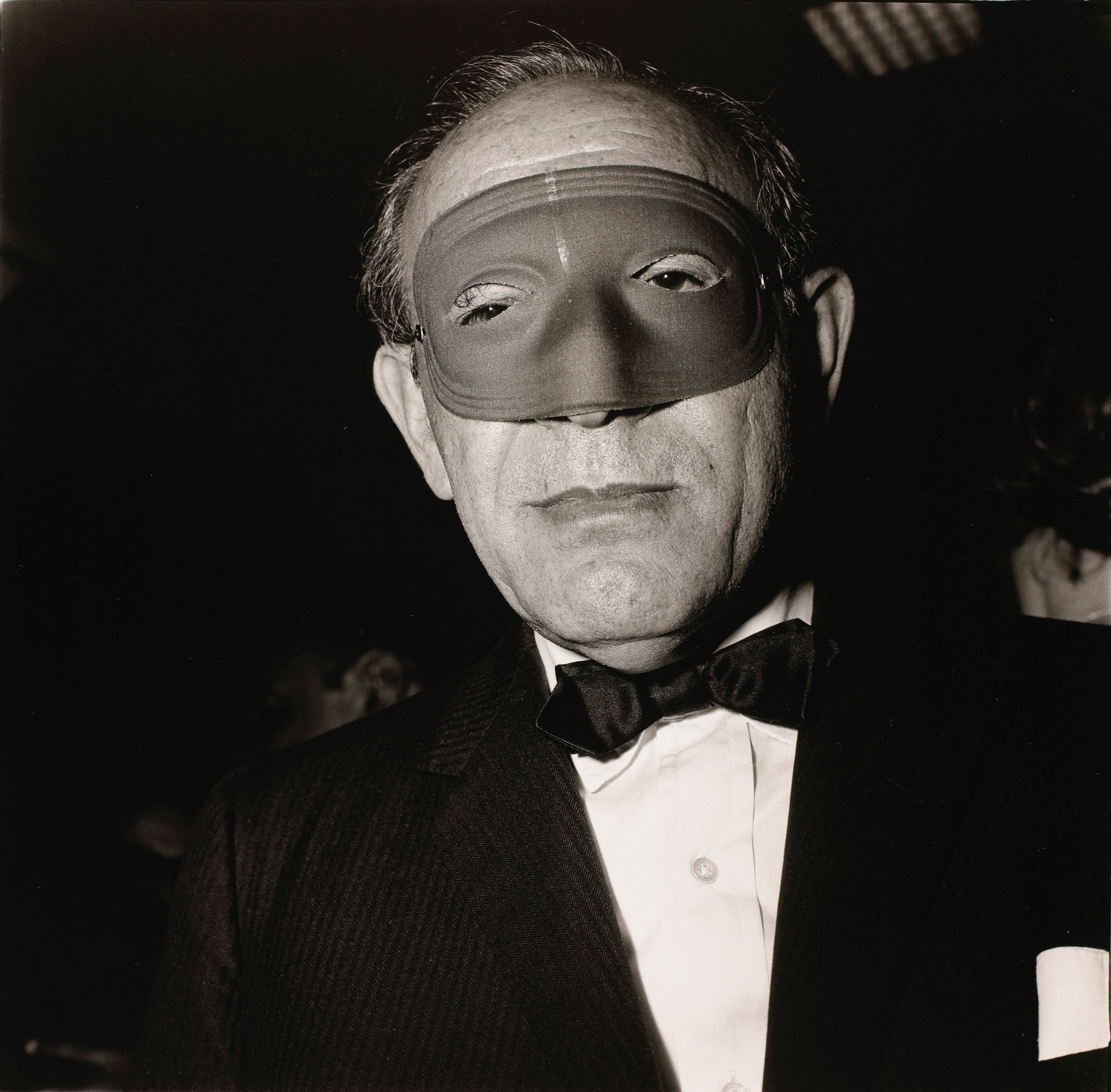 Masked man at a ball, N.Y.C.