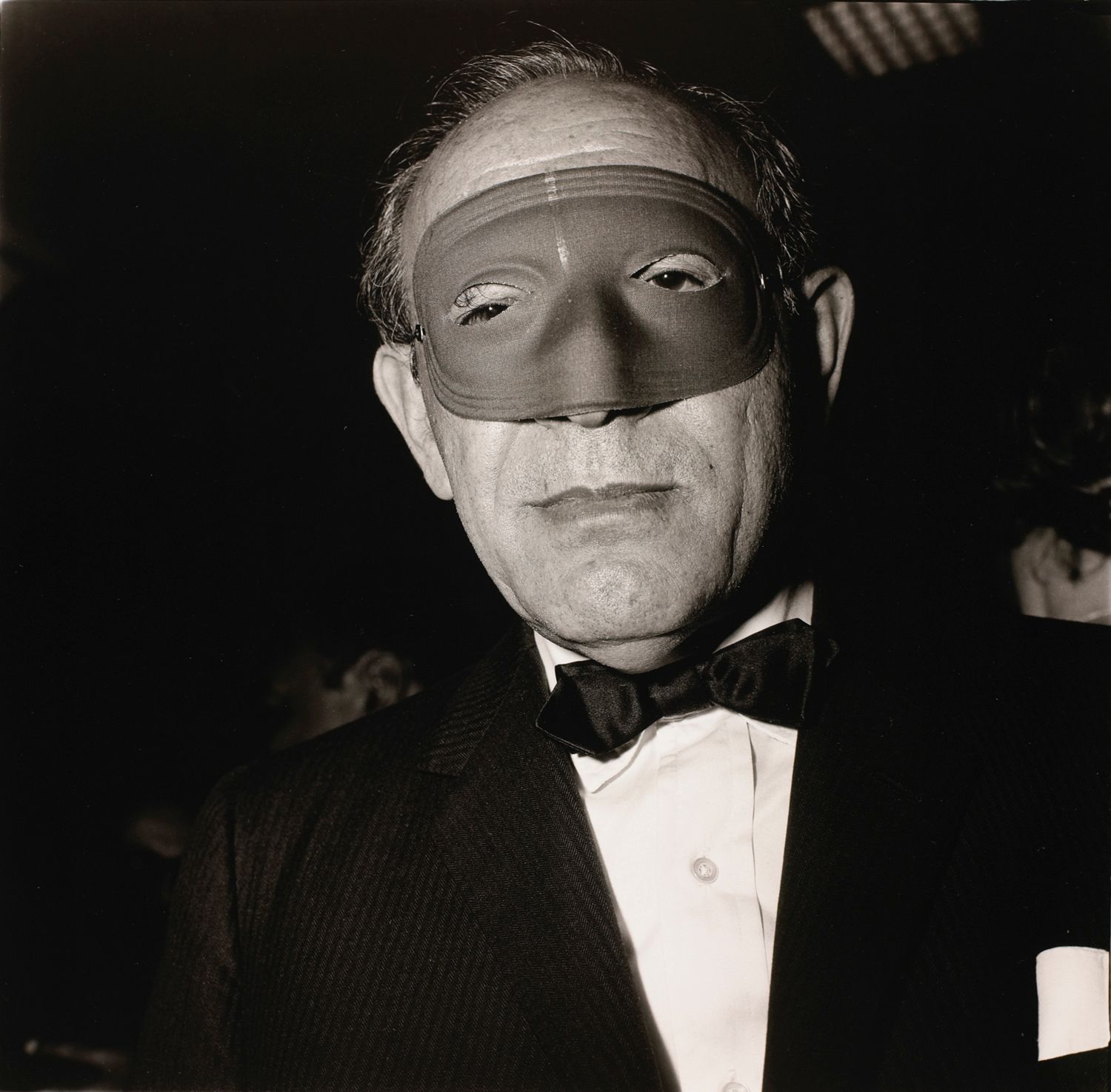 Masked man at a ball, N.Y.C.