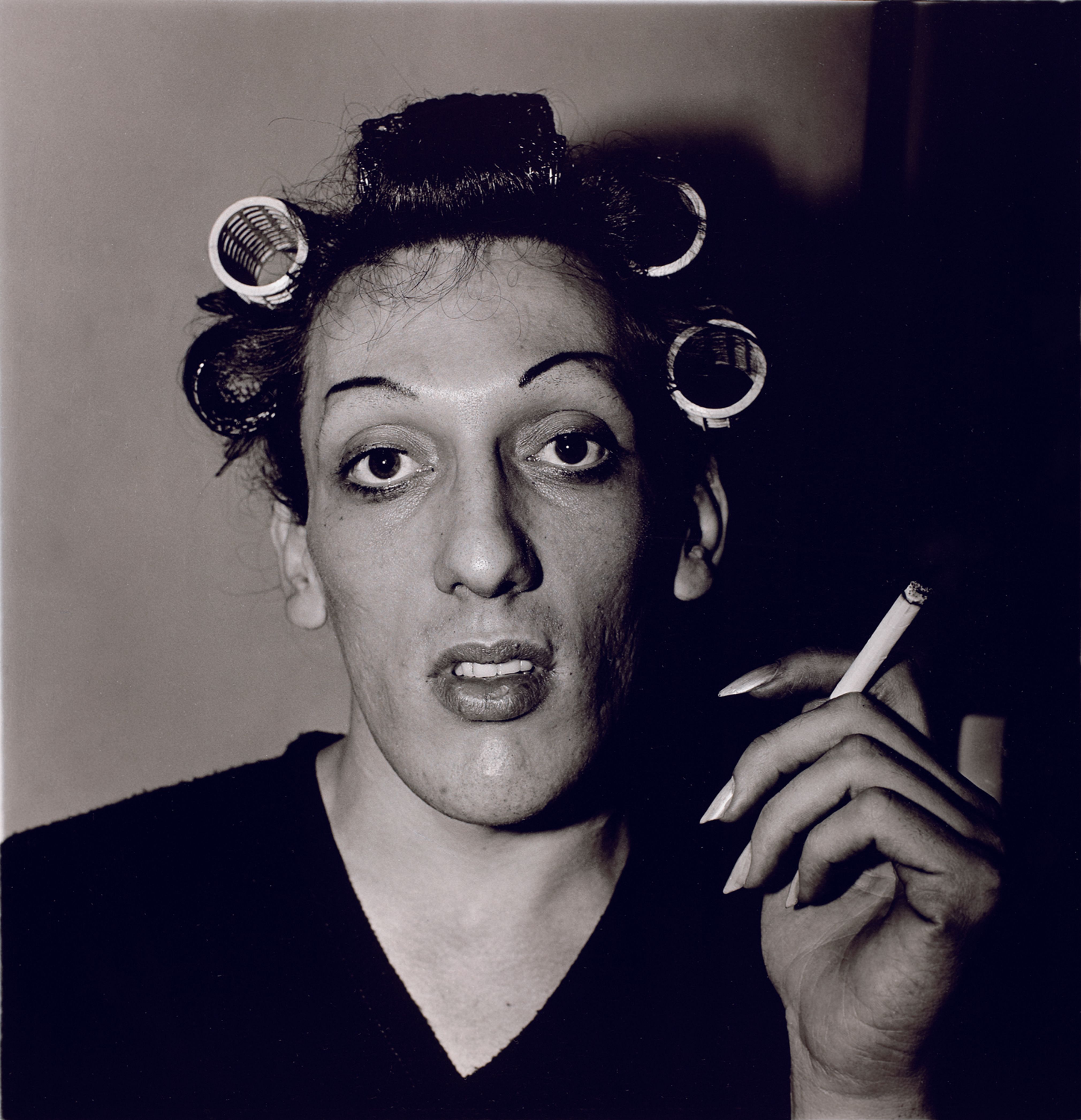 A young man in curlers at home on West 20th Street, N.Y.C.