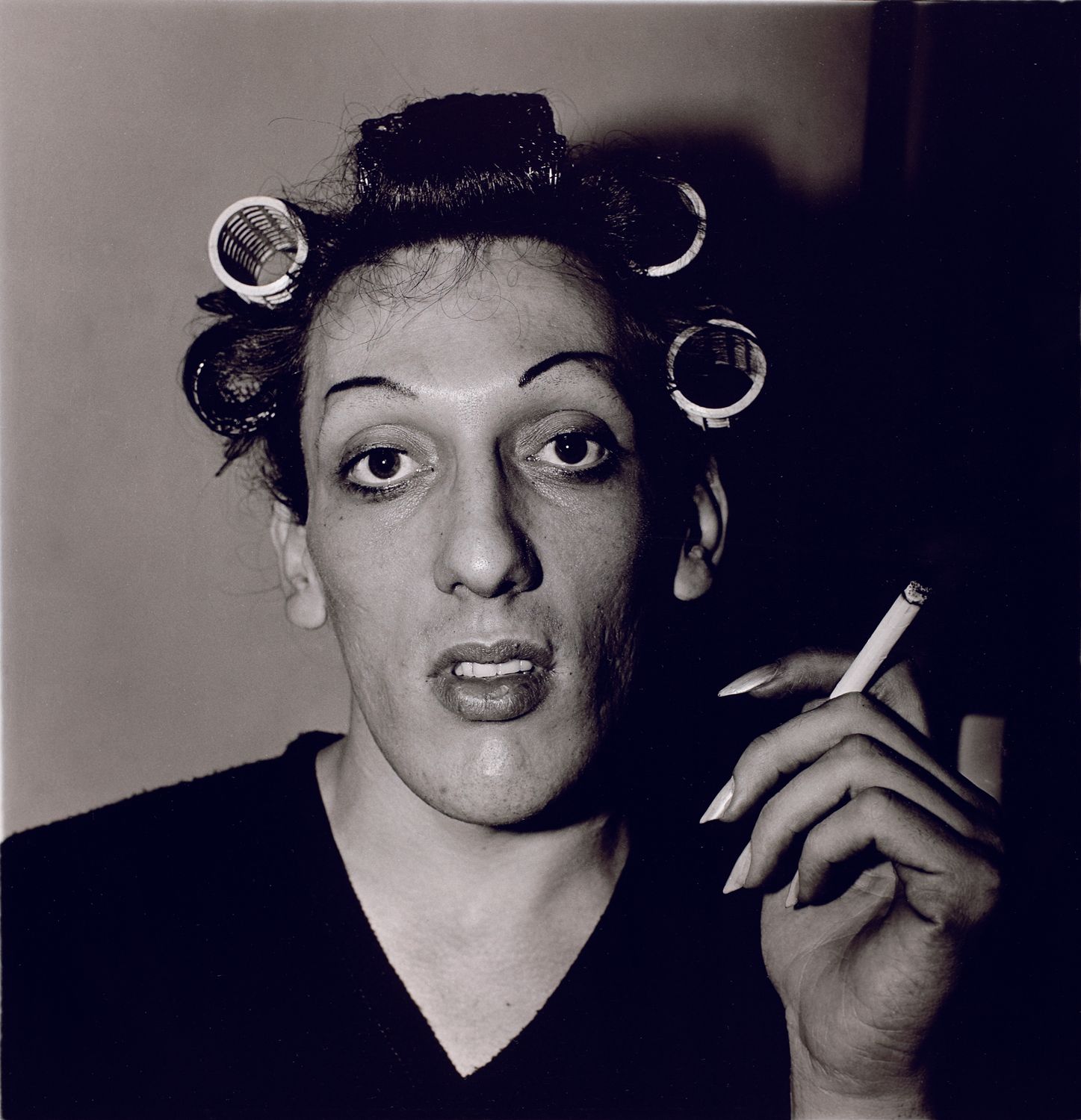 A young man in curlers at home on West 20th Street, N.Y.C.