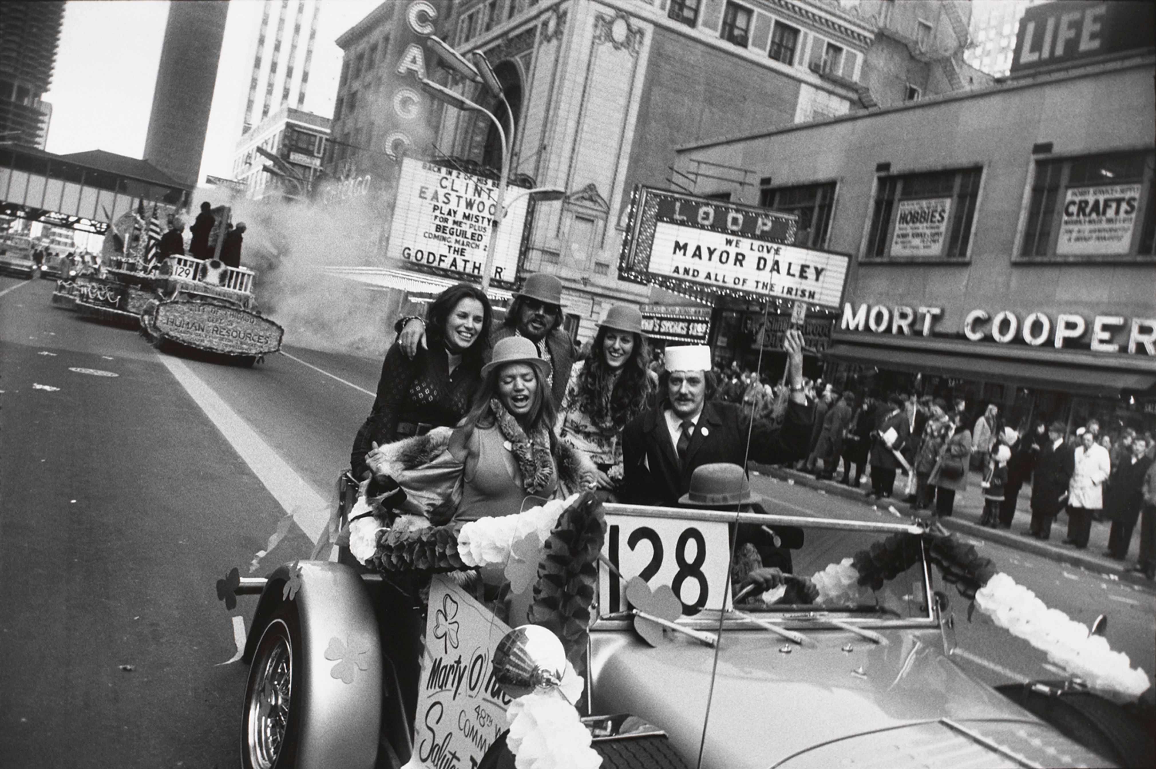 Untitled (A group of men and women riding in the St. Patrick’s Day Parade, Chicago)