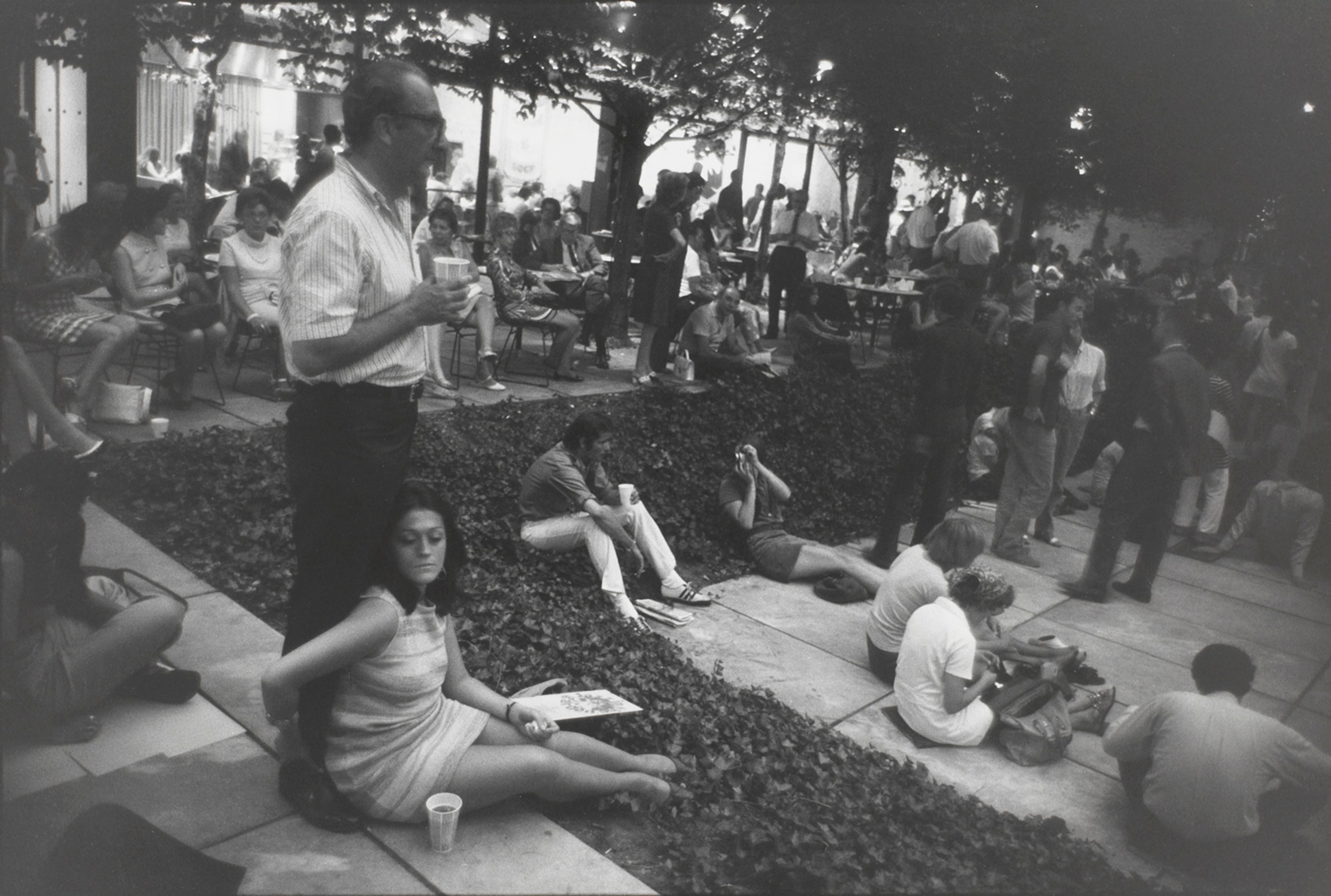 Untitled (People gathered in MOMA’s outdoor courtyard, at night)