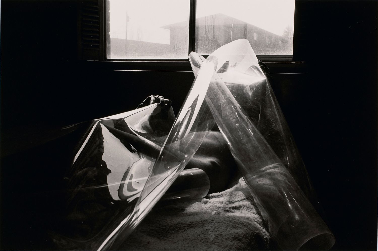 Untitled: Reclining Woman Holding Plastic