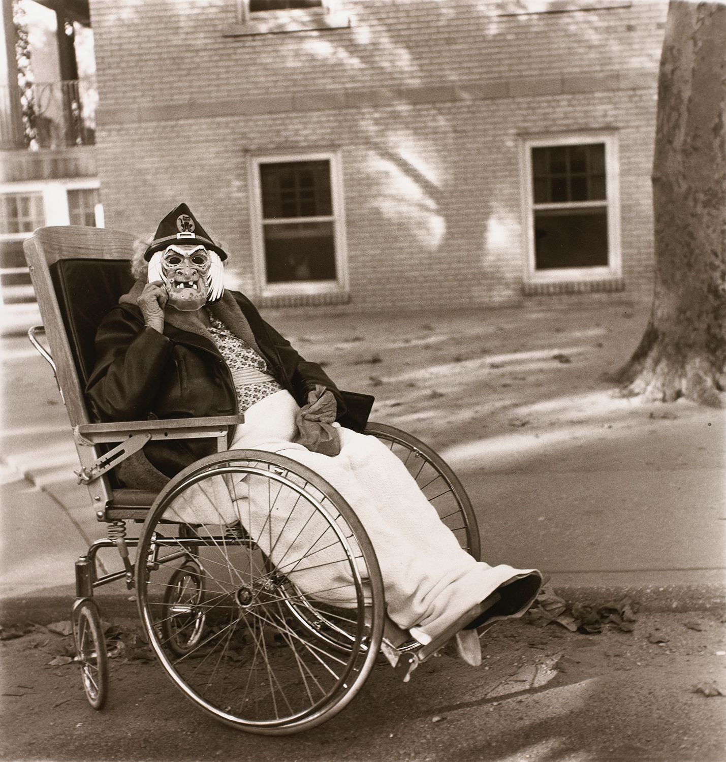 Masked woman in a wheelchair, Pa.