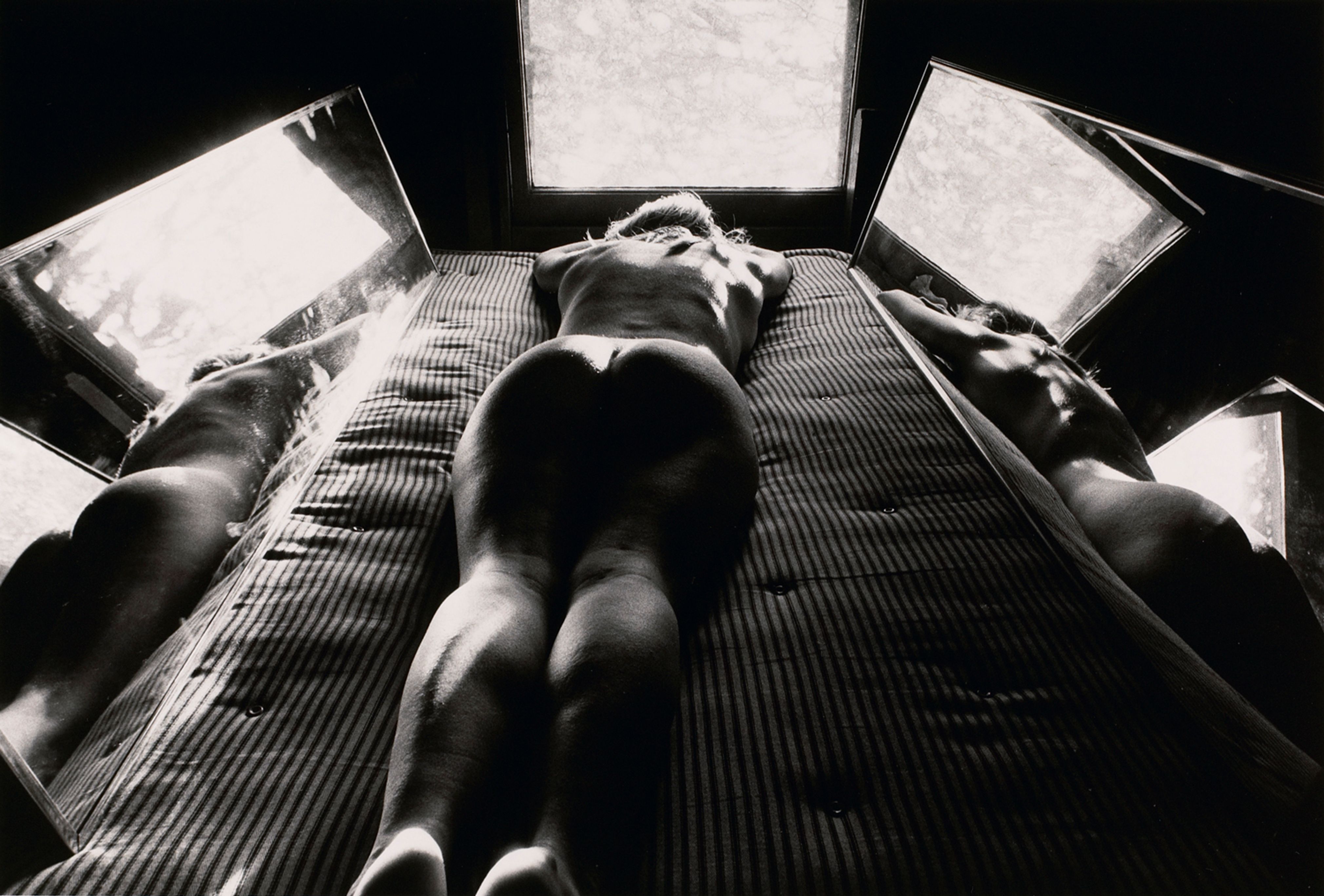 Untitled: Woman on Bed with Mirrors on Either Side