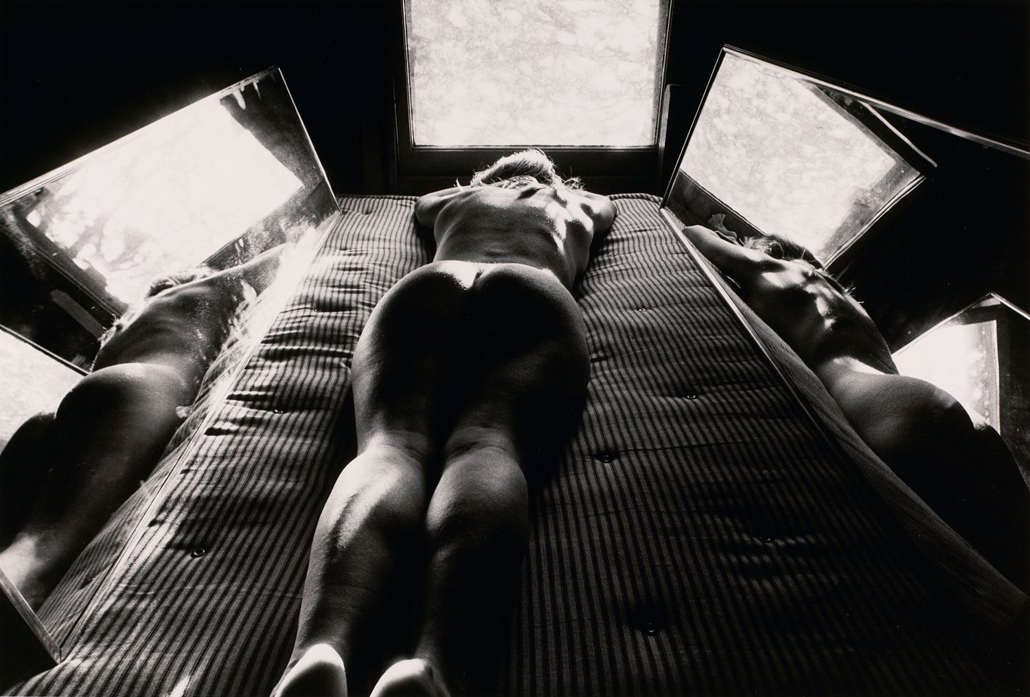 Untitled: Woman on Bed with Mirrors on Either Side