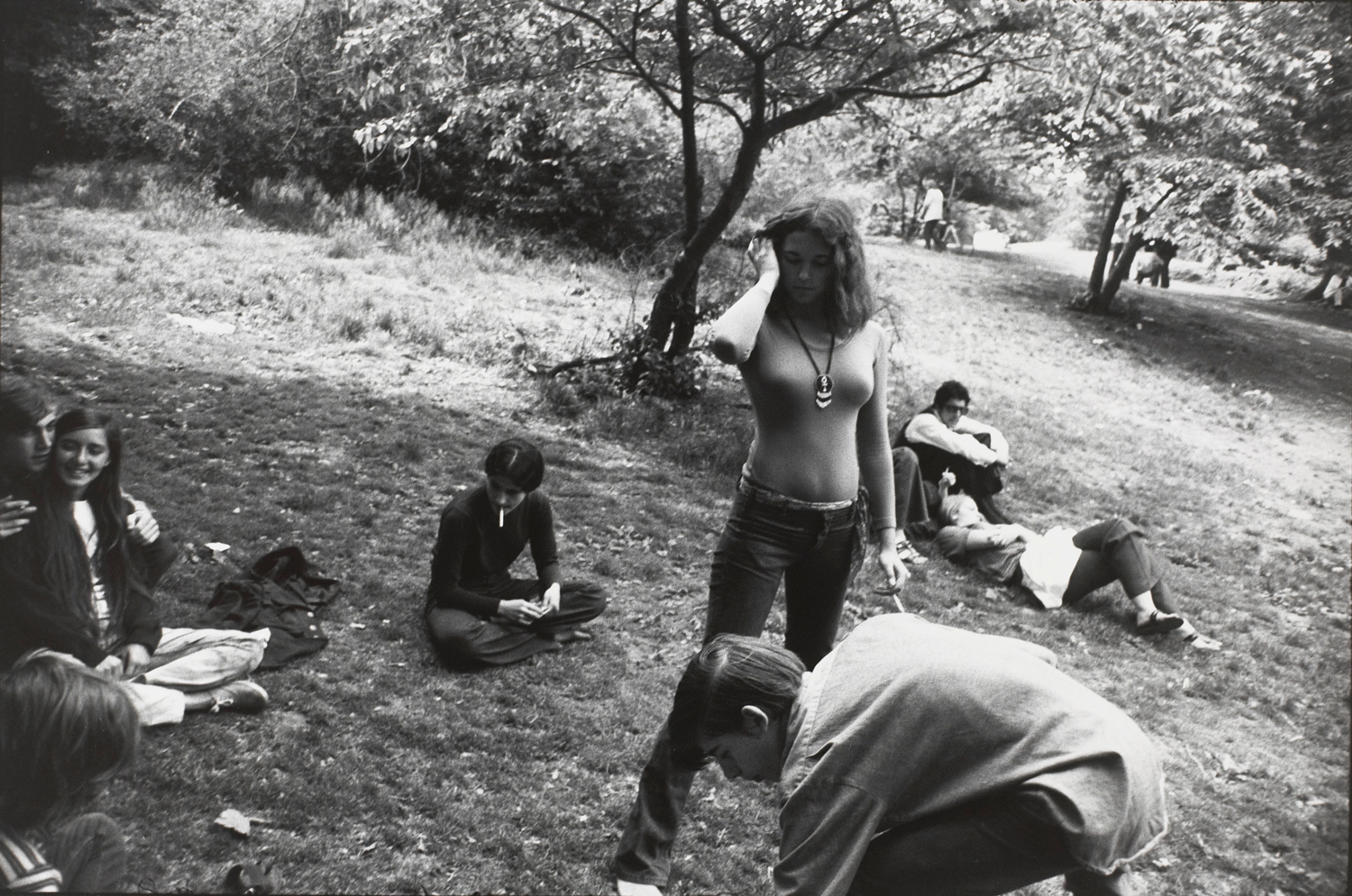 Untitled (A group of people hanging out in a park)