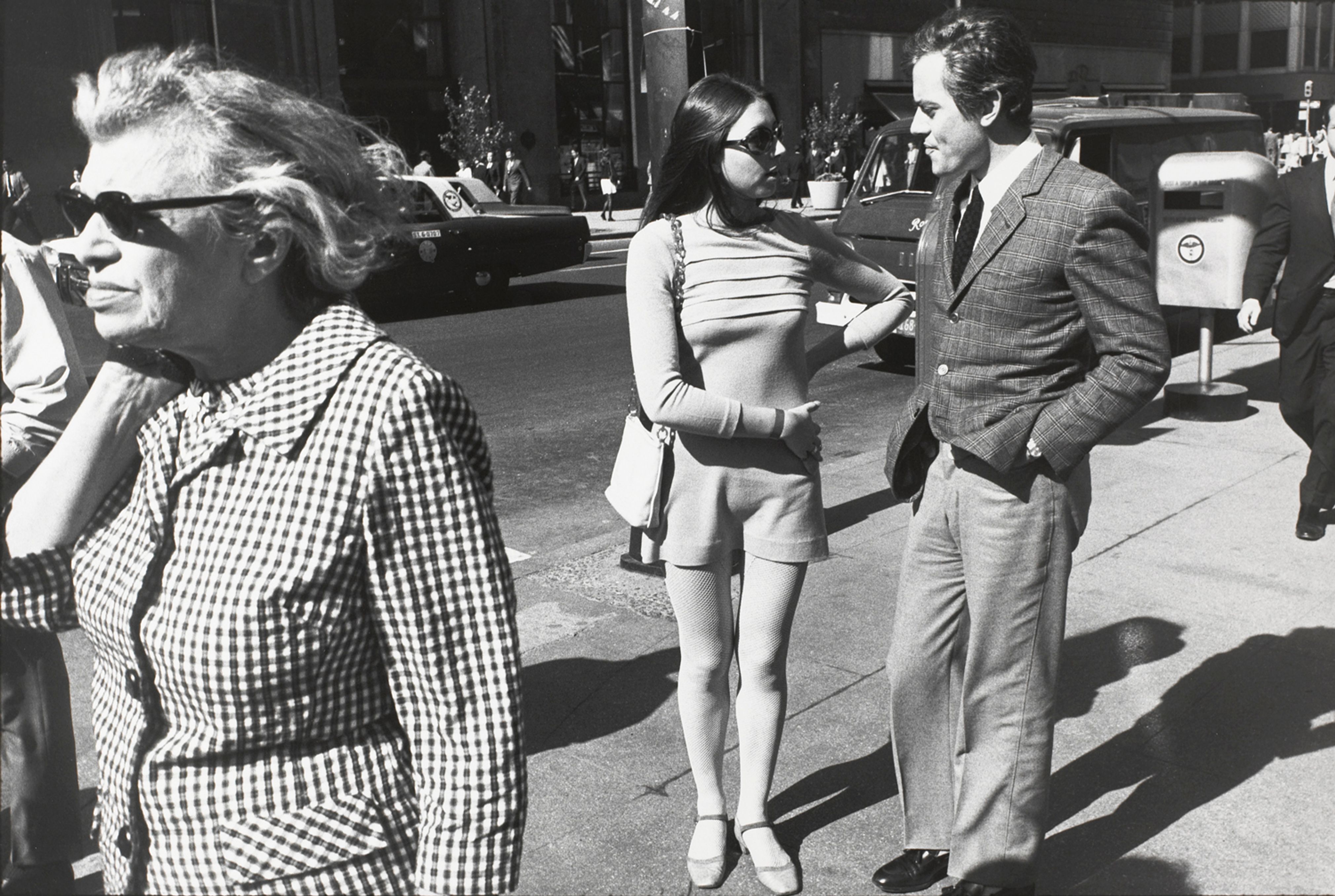 Untitled (Woman with hands on hip talking to a man on the street)