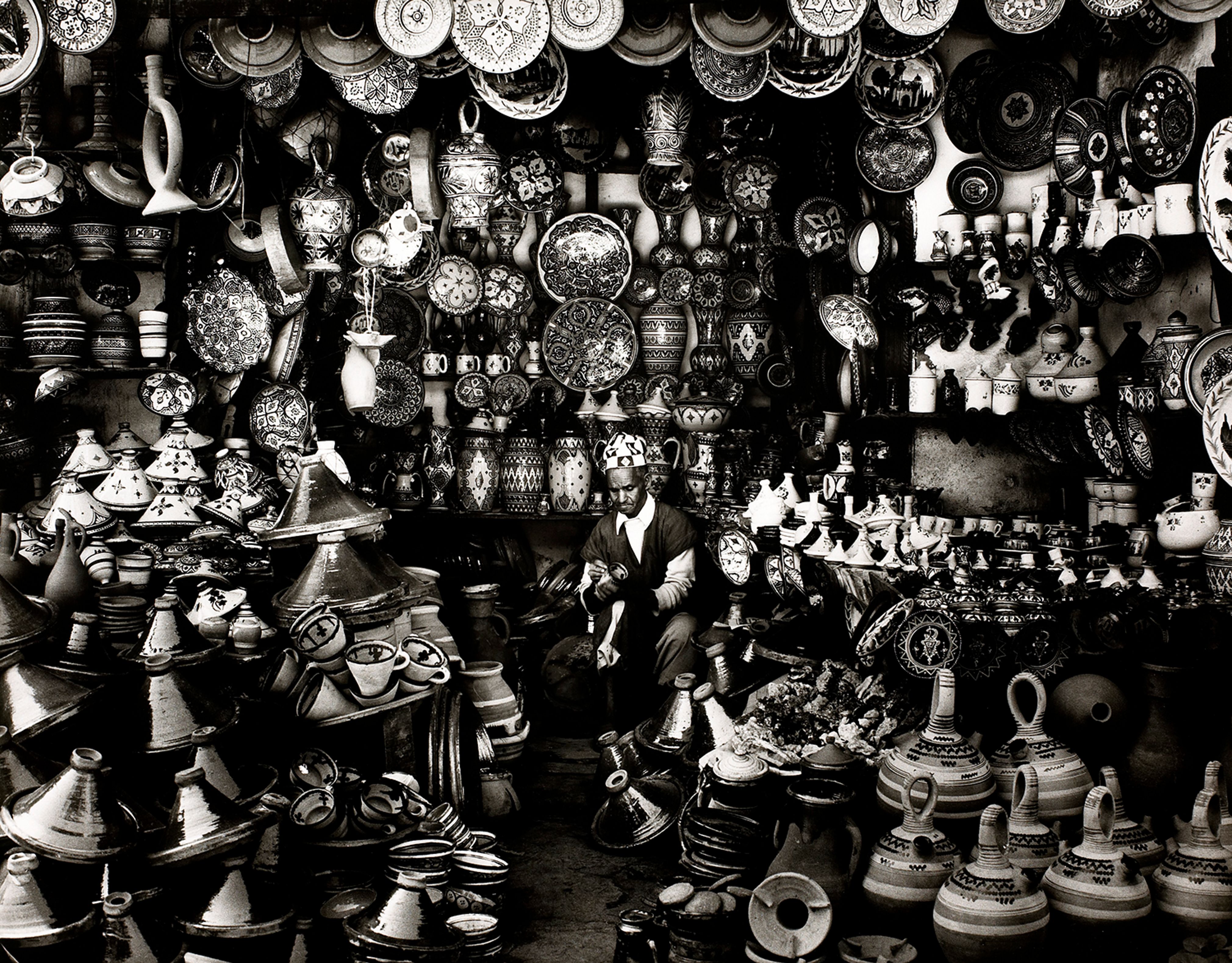 Shopkeeper with Clay Pots in Marrakech