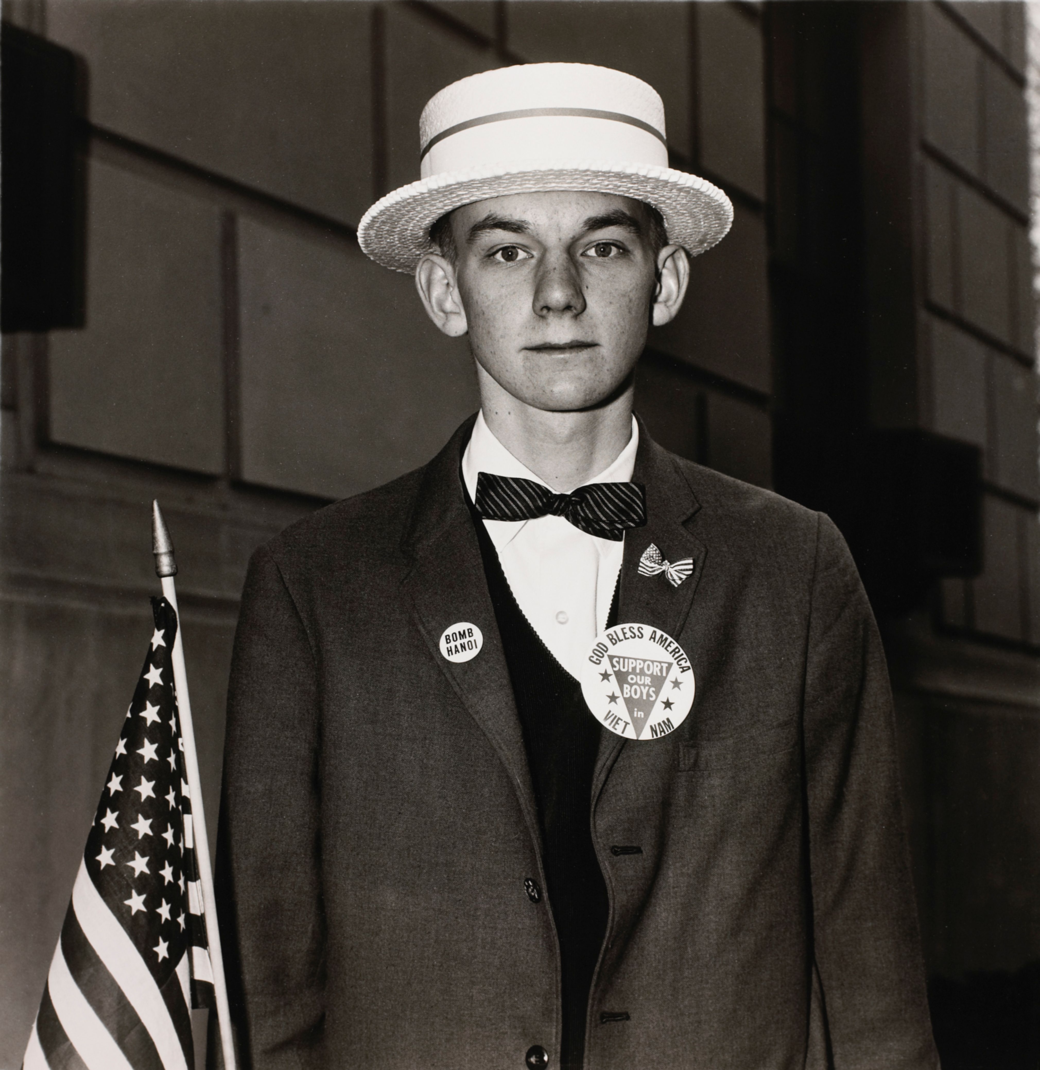 Boy with a straw hat waiting to march in a pro-war parade, N.Y.C.