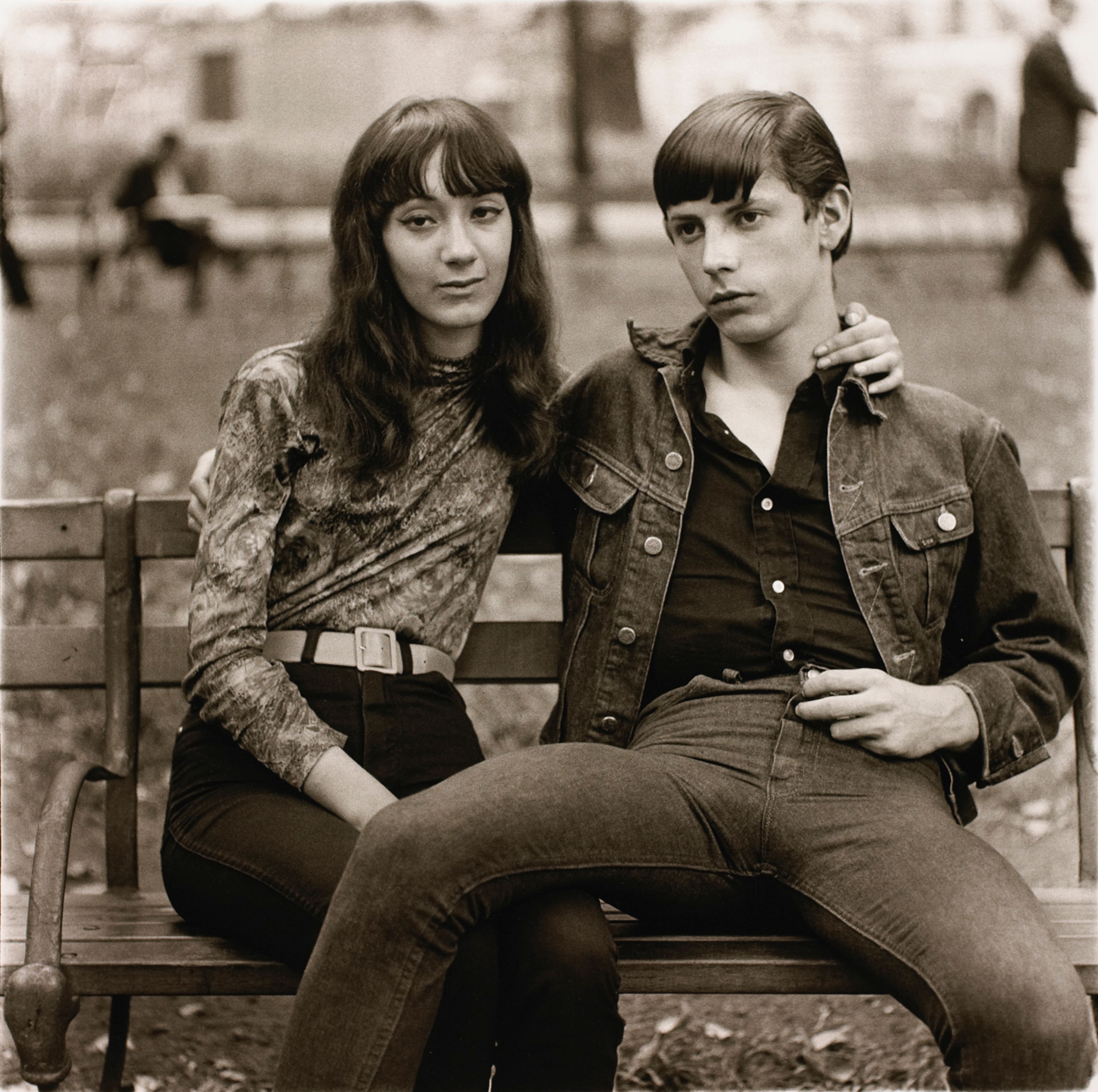 A young couple on a bench in Washington Square Park, N.Y.C.