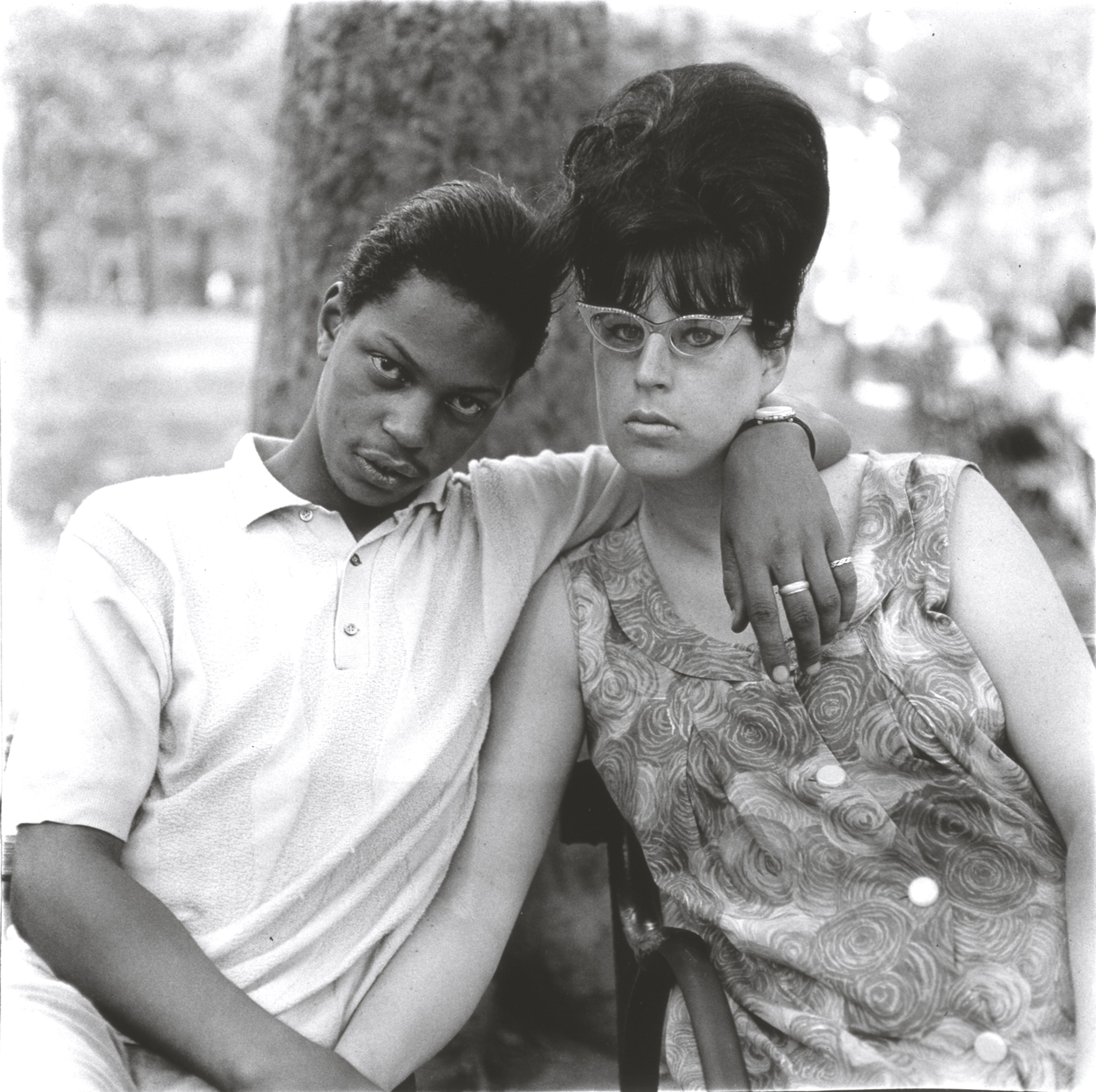 A young man and his pregnant wife in Washington Square Park, N.Y.C.