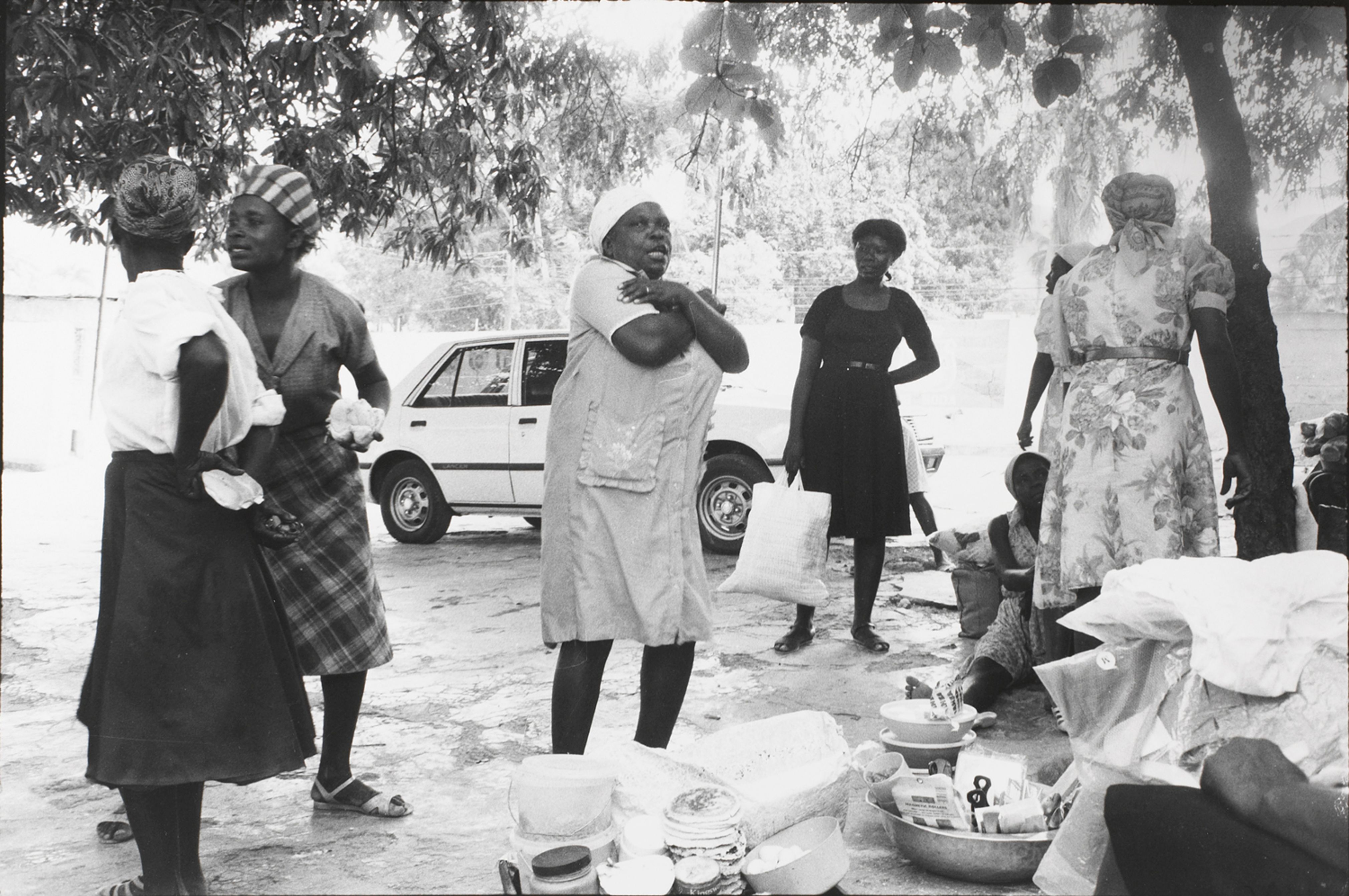 Women that sell food outside the Copa Club reenact the attacks upon the Tontons Macoute
