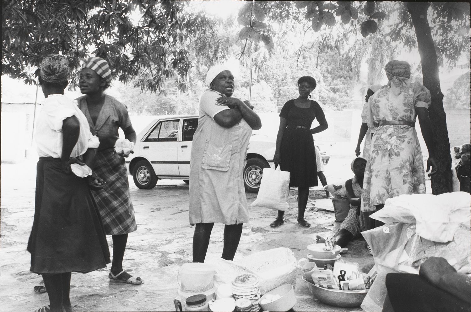 Women that sell food outside the Copa Club reenact the attacks upon the Tontons Macoute