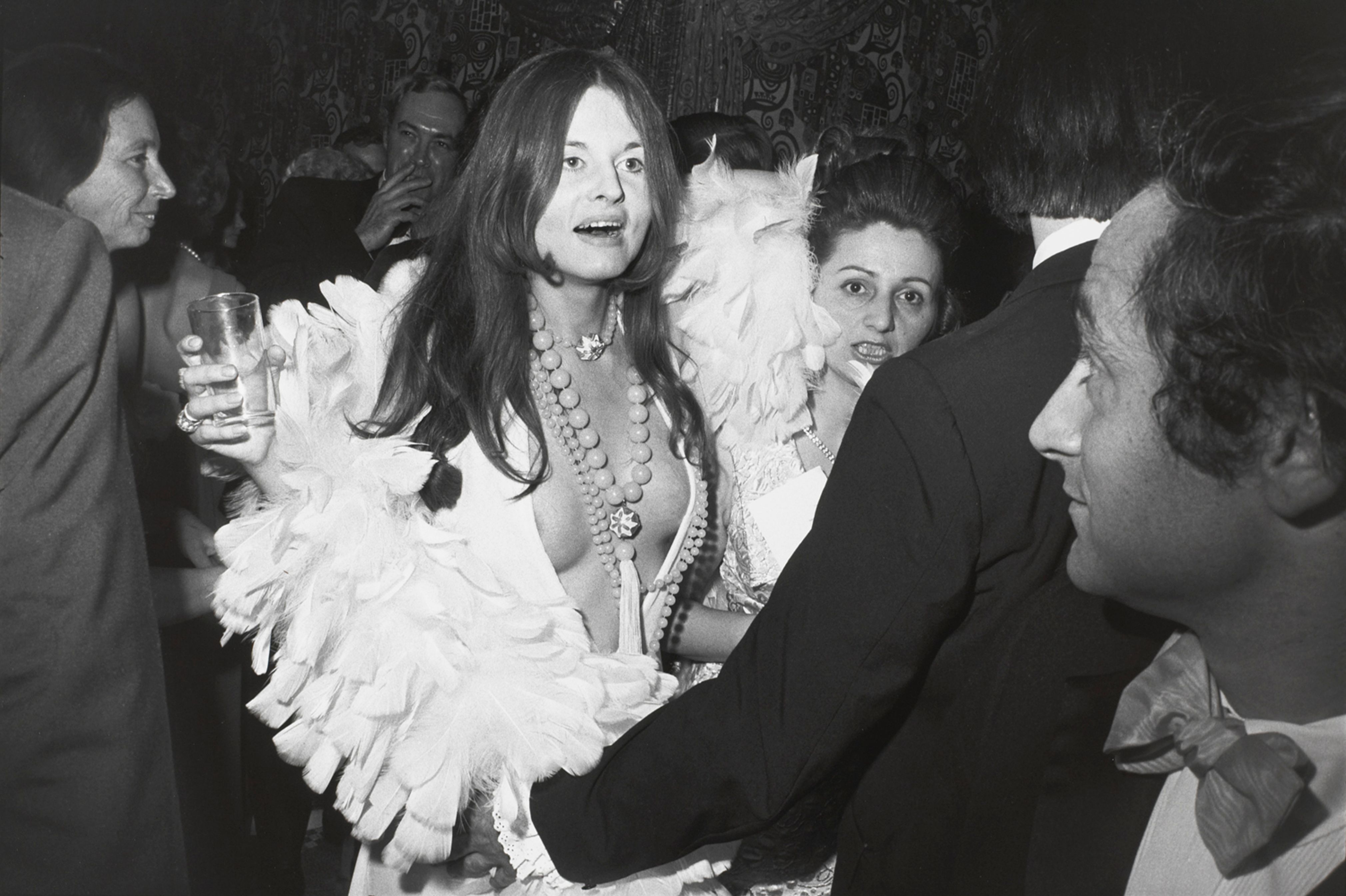Untitled (Woman in feather trimmed low cut dress)