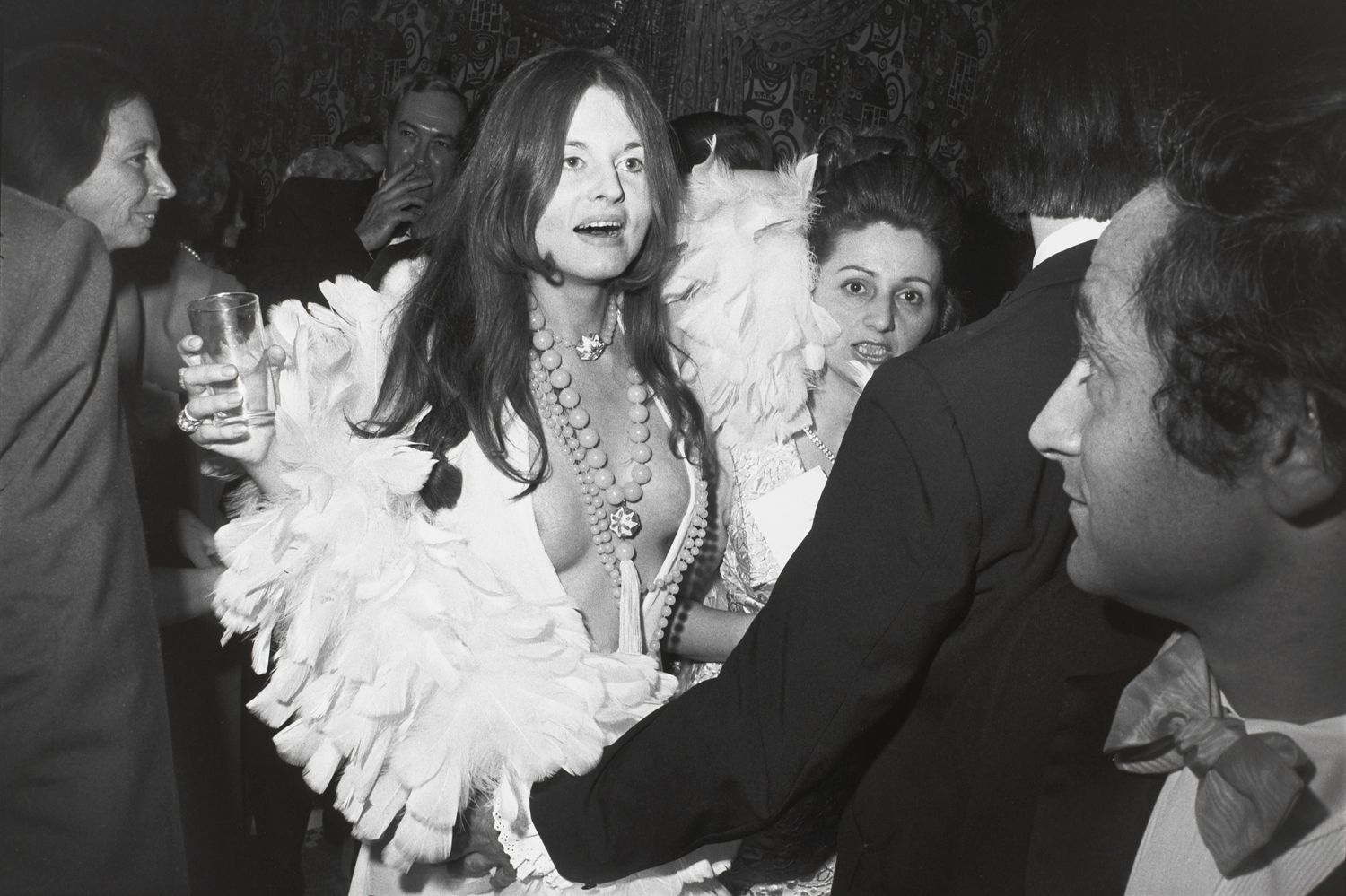 Untitled (Woman in feather trimmed low cut dress)