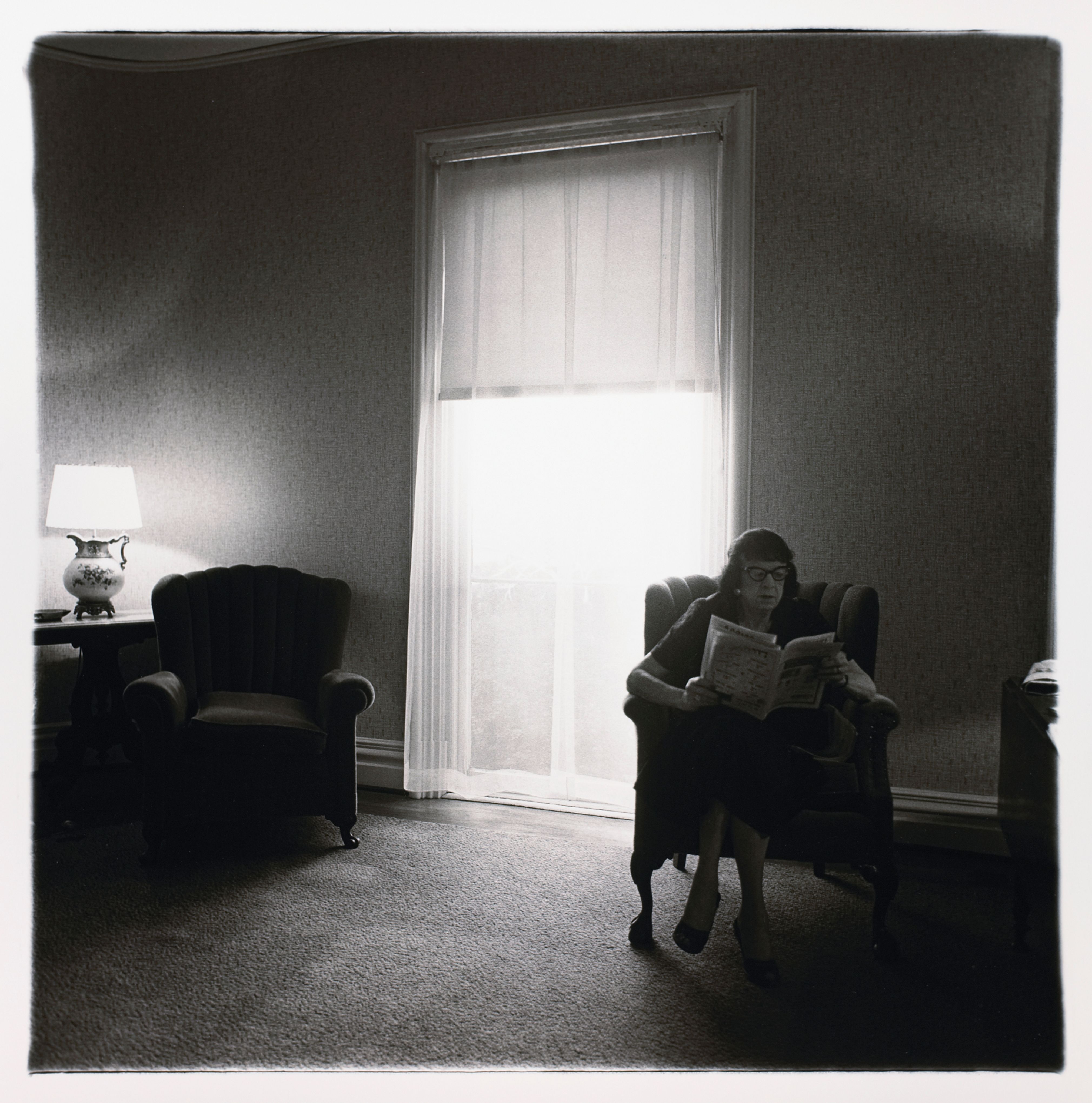 Lady in rooming house parlor, Albion, N.Y.