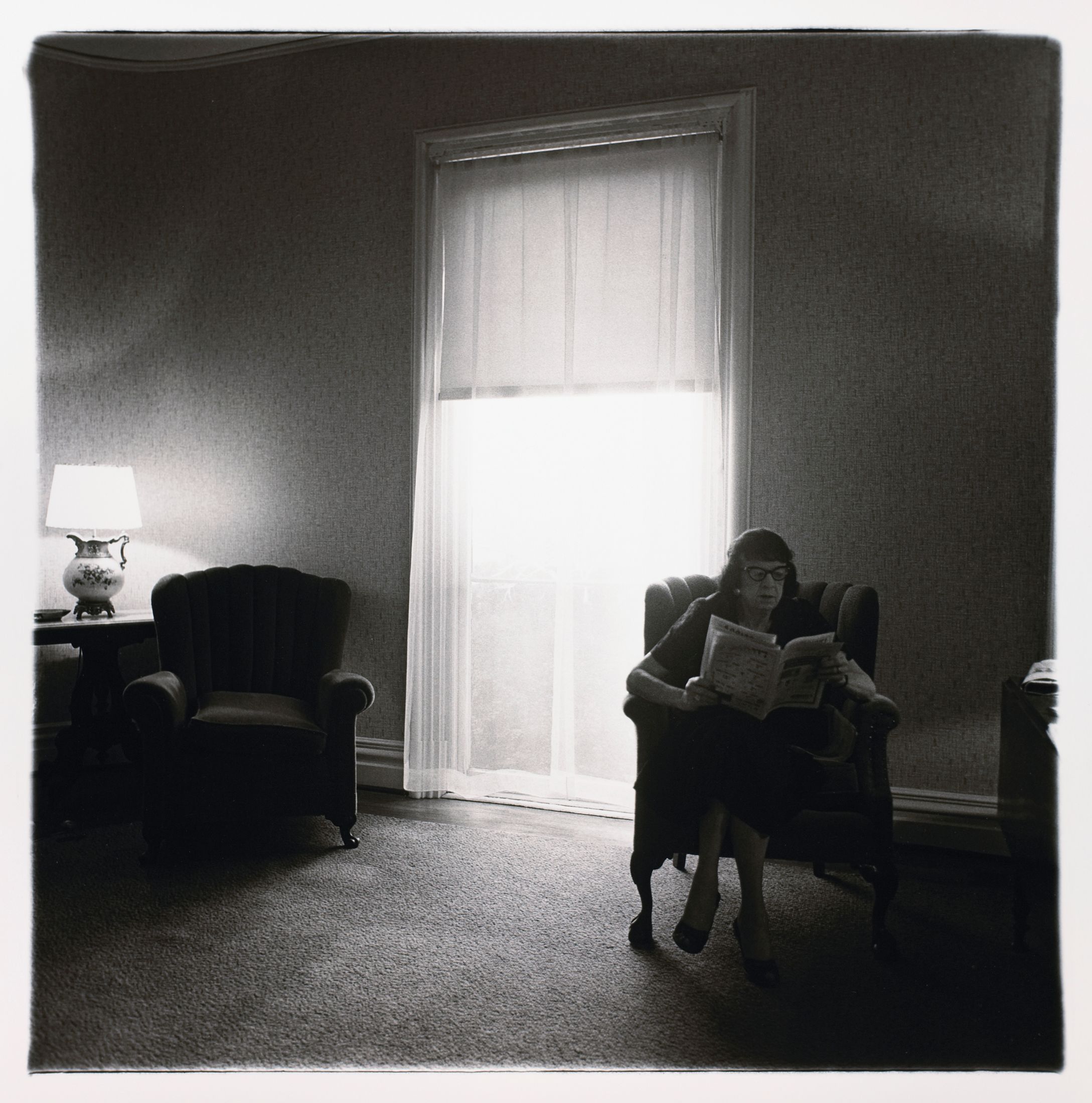 Lady in rooming house parlor, Albion, N.Y.
