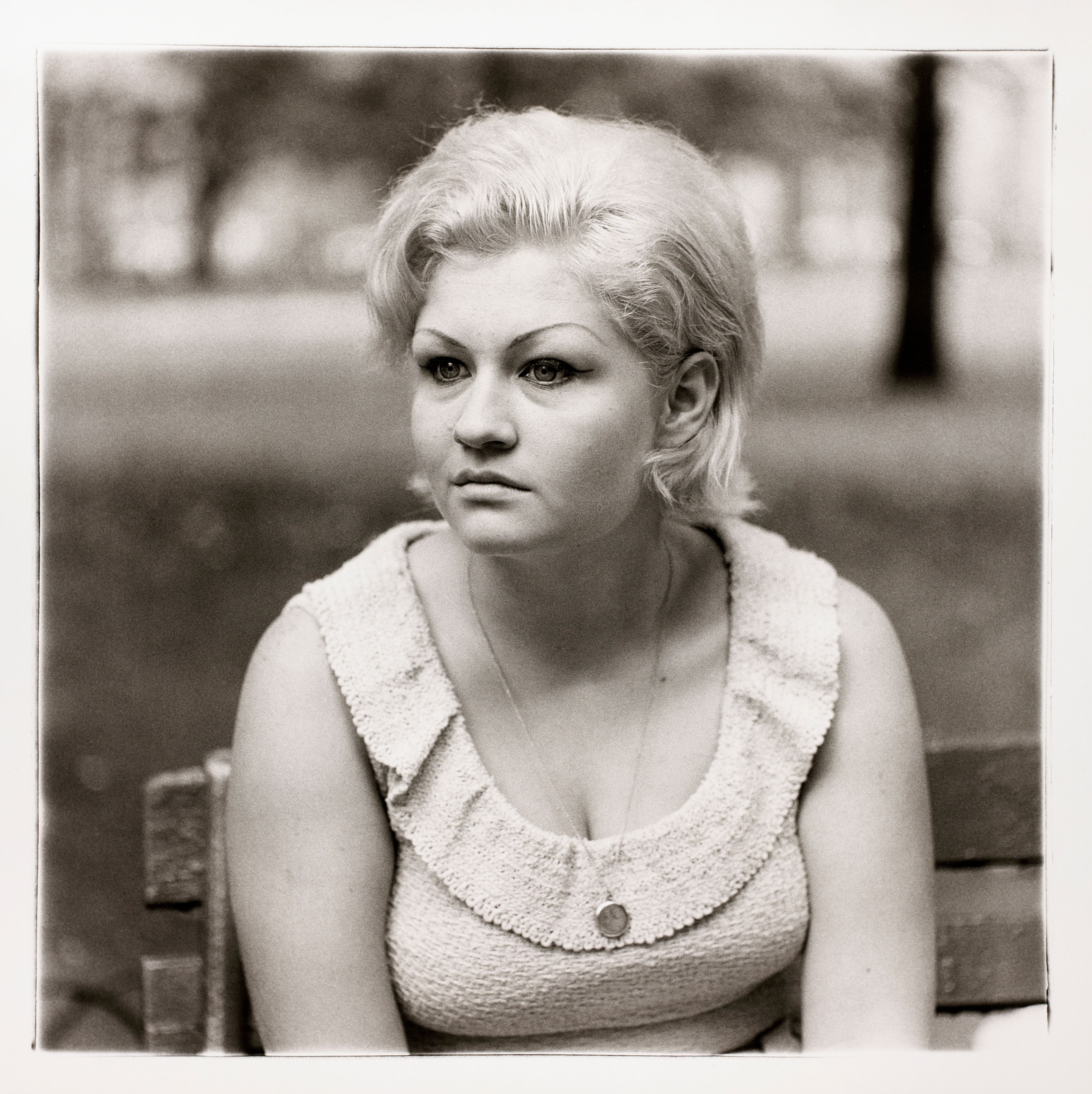 Woman with a locket in Washington Square Park, N.Y.C.