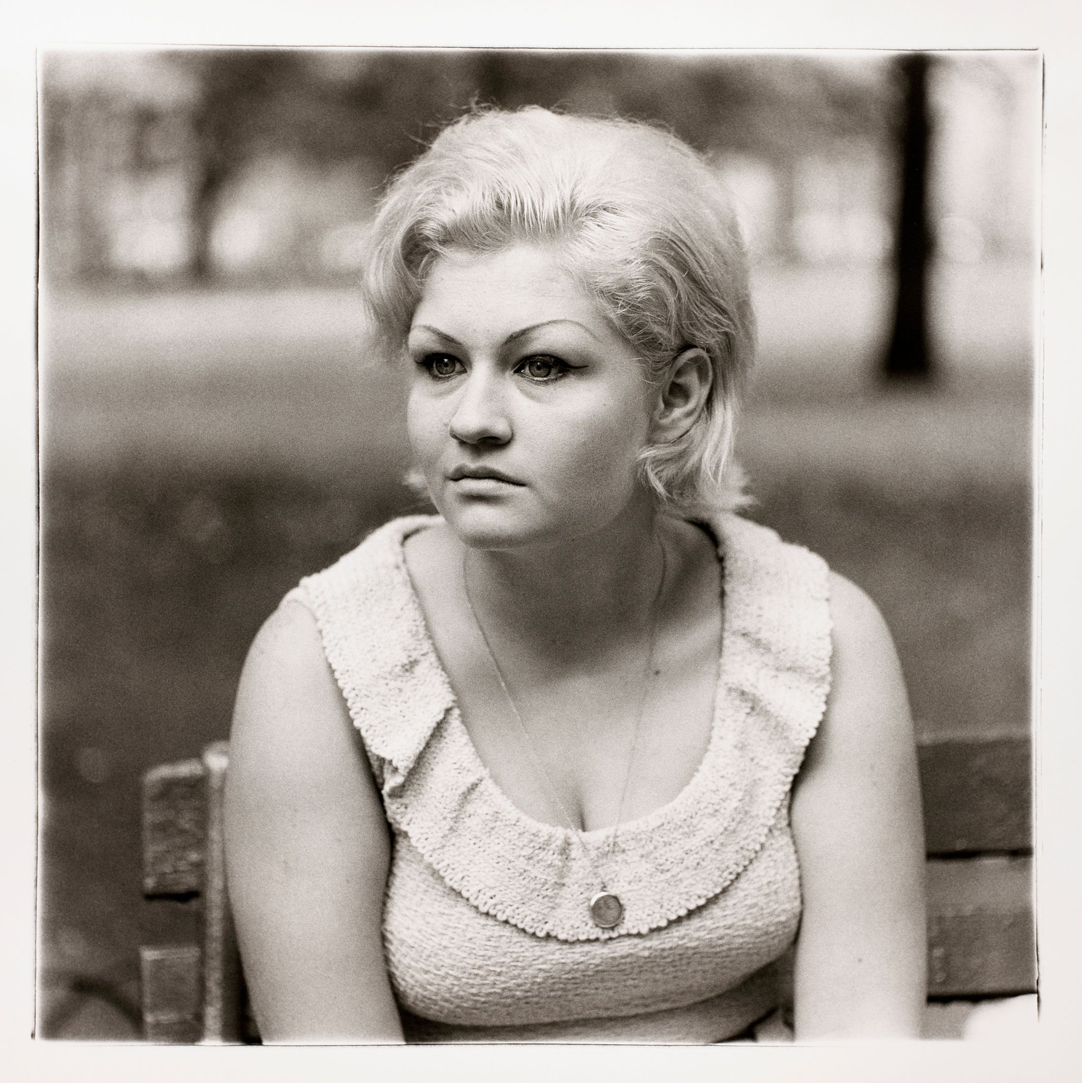 Woman with a locket in Washington Square Park, N.Y.C.