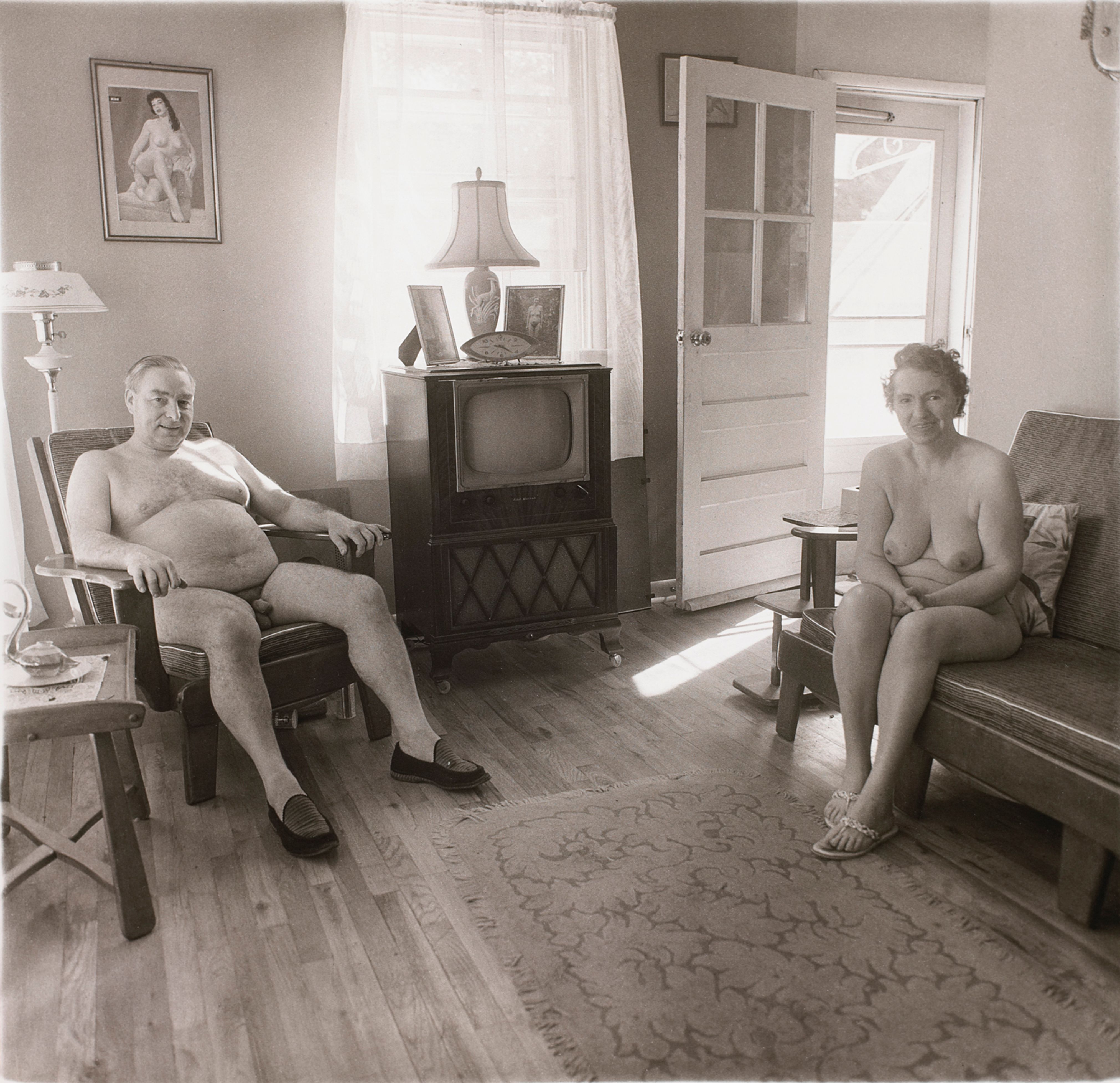 Reitred man and his wife at home in nudist camp one morning, N.J.