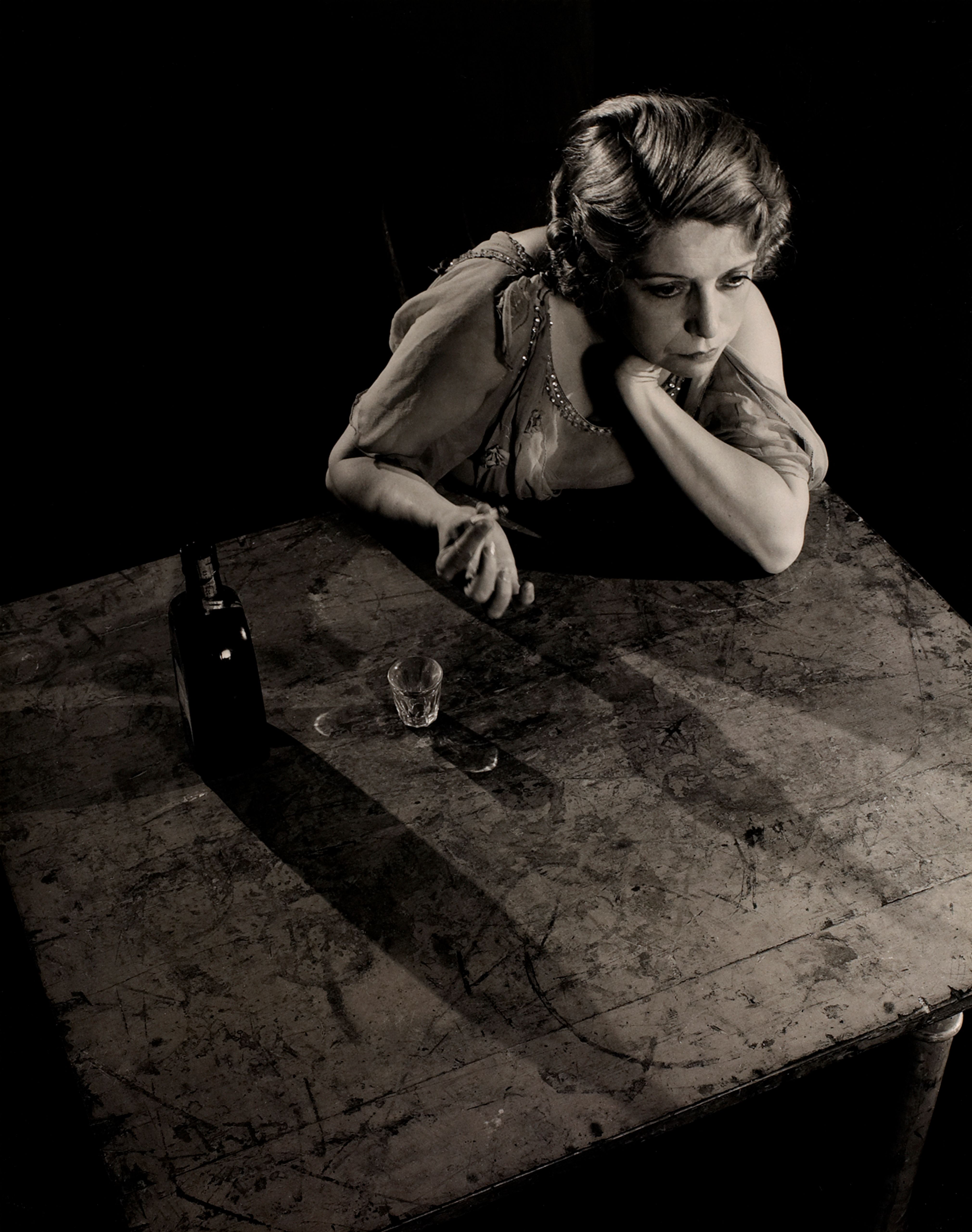 Sad Woman at Table