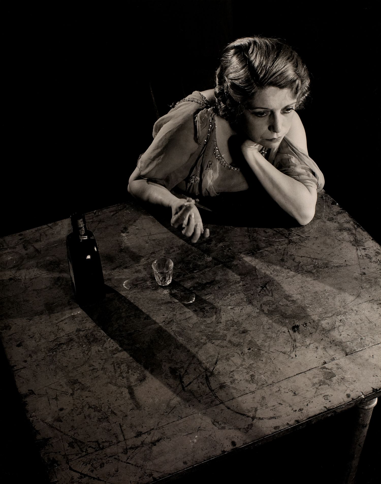 Sad Woman at Table