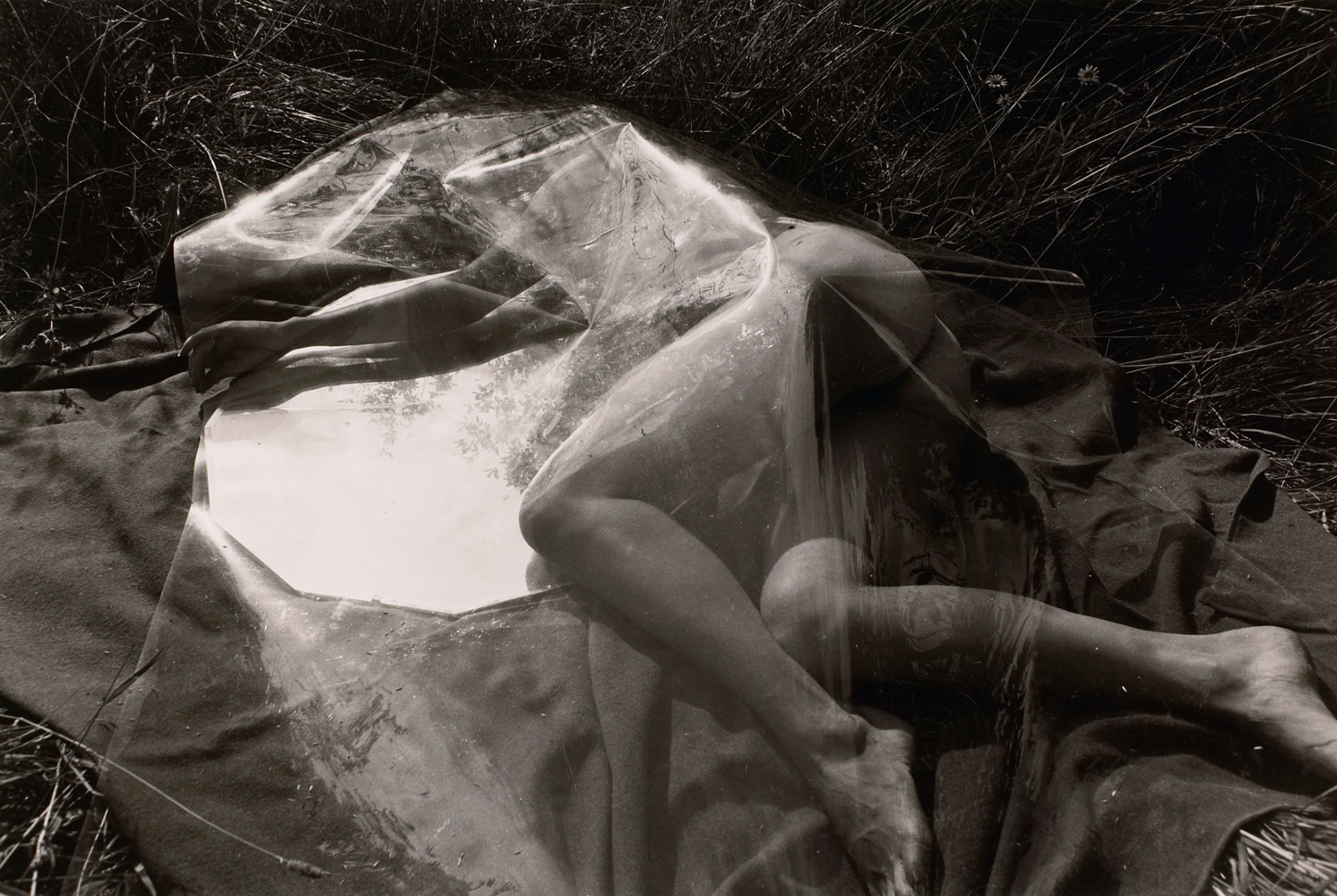 Untitled: Woman Resting Under Plastic with Mirror