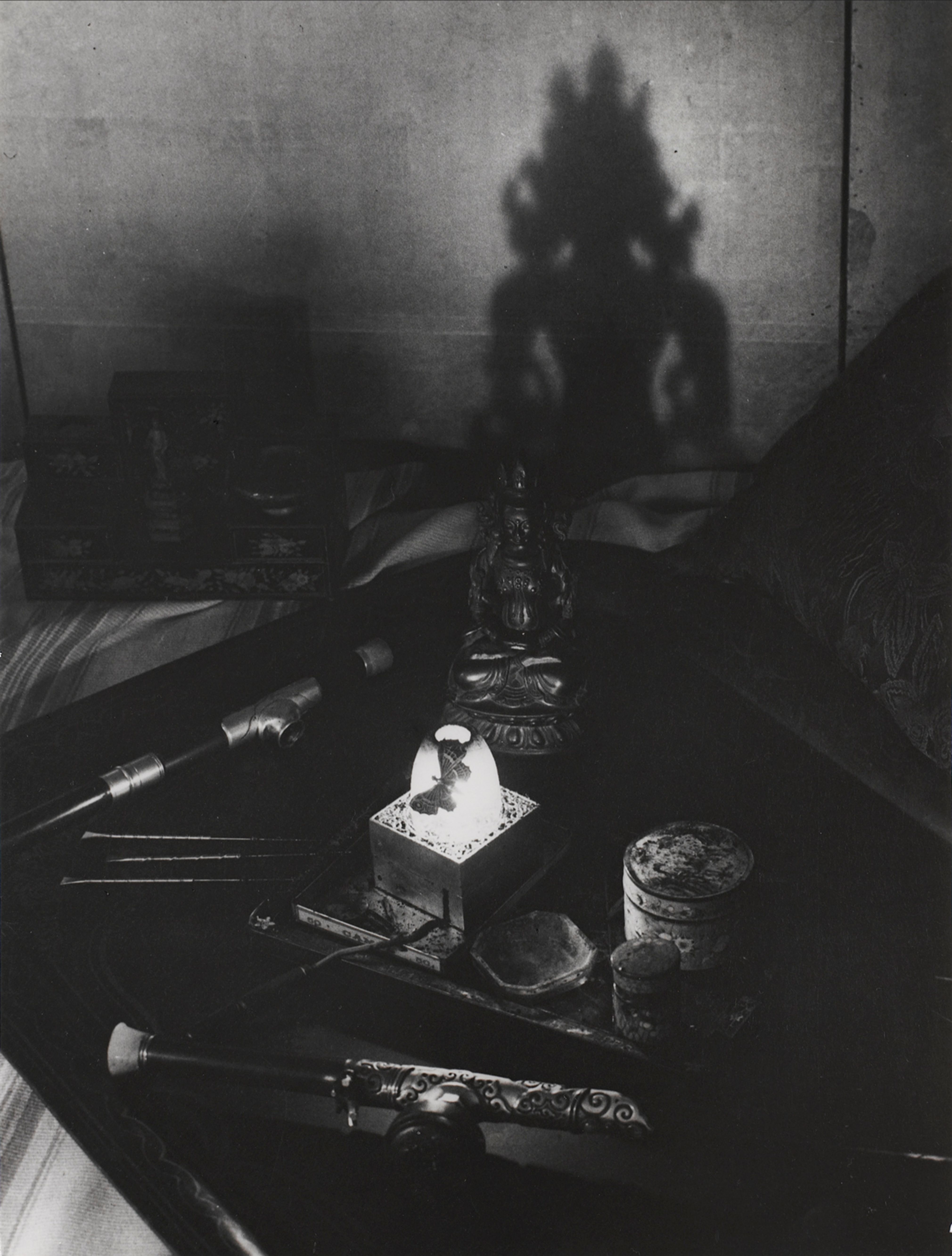 An opium den, Avenue Bosquet. A tray with pipes, pins, oil lamp