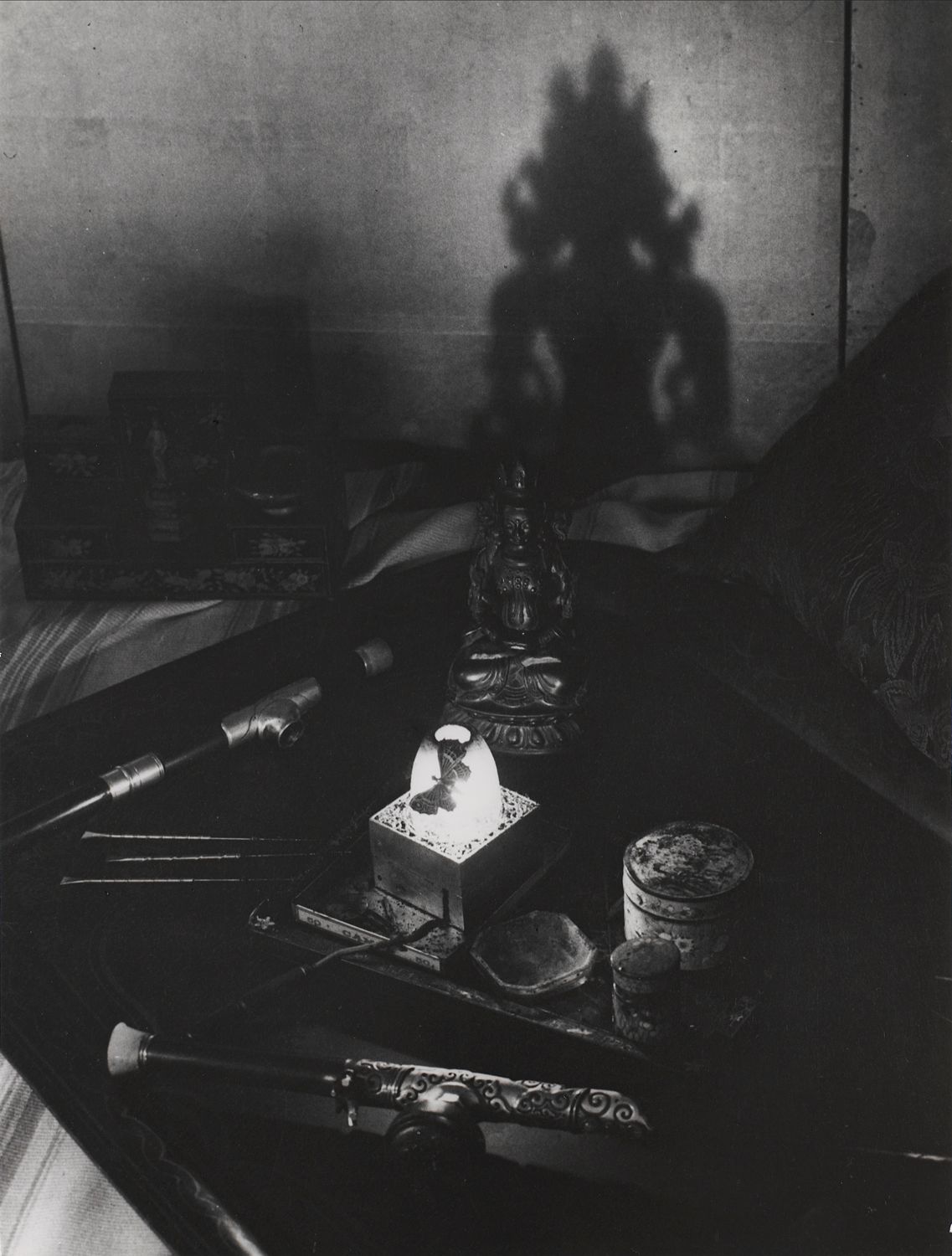 An opium den, Avenue Bosquet. A tray with pipes, pins, oil lamp