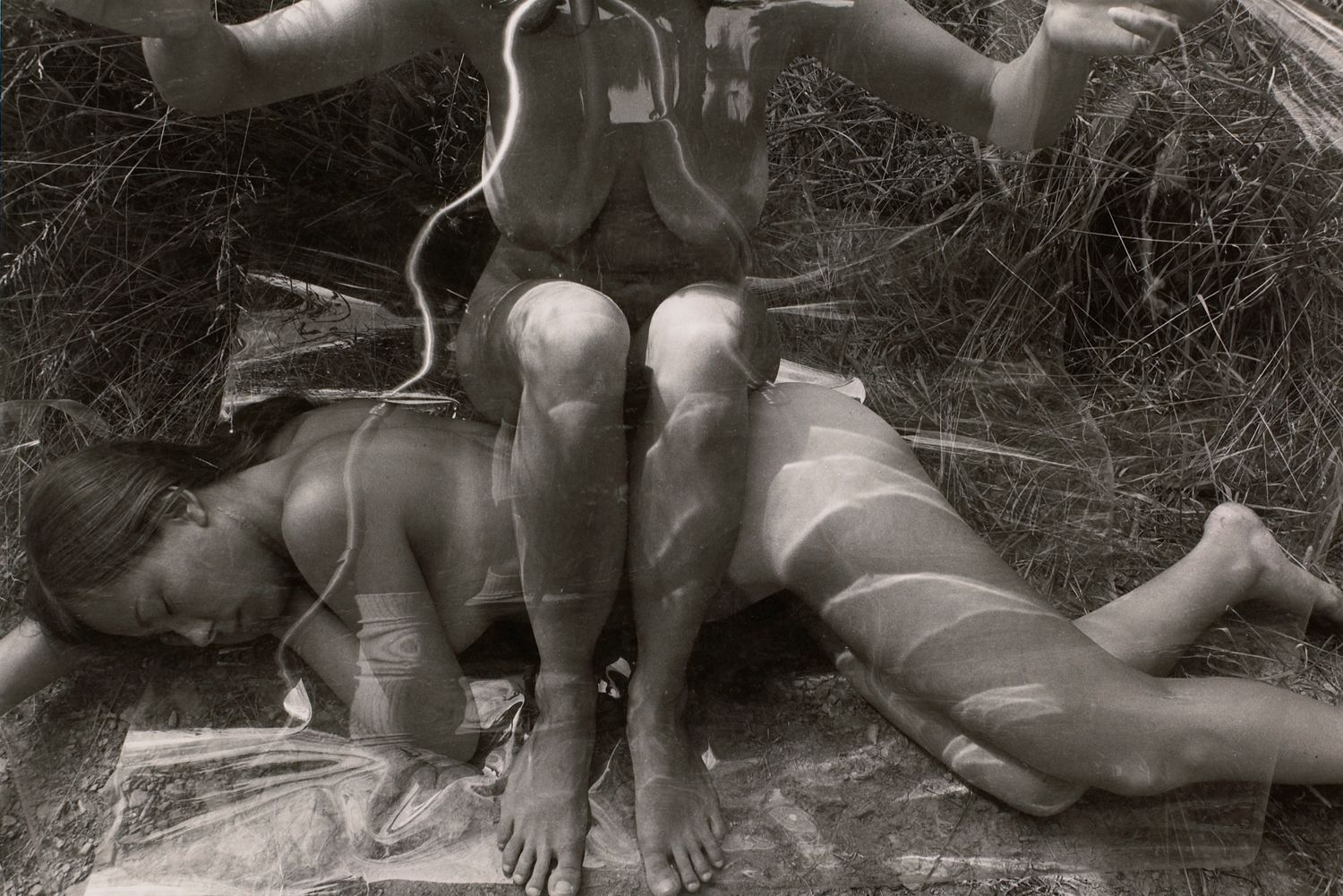 Untitled: Woman Sitting on Woman with Plastic
