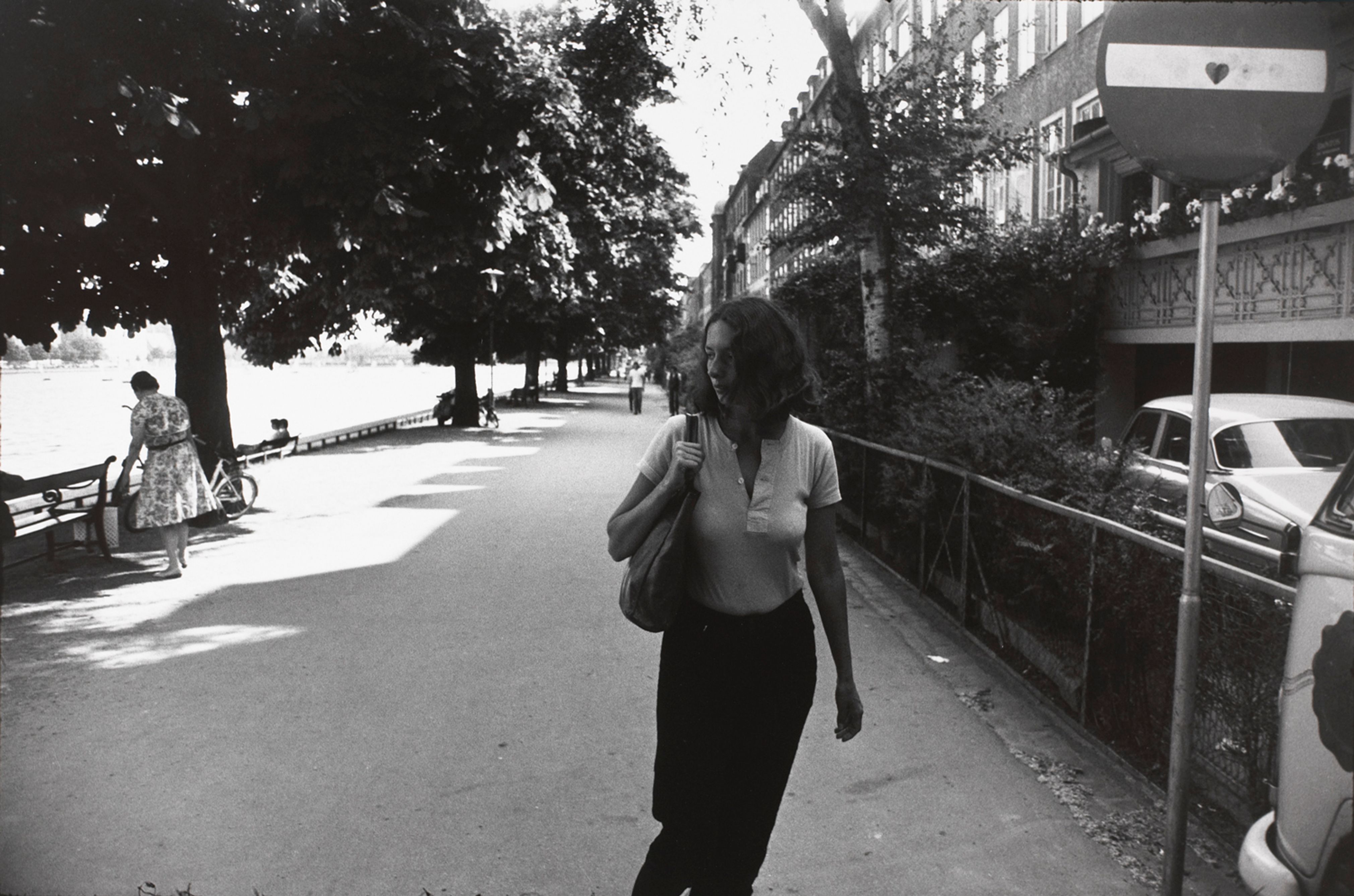 Untitled (Woman walking along side a river)
